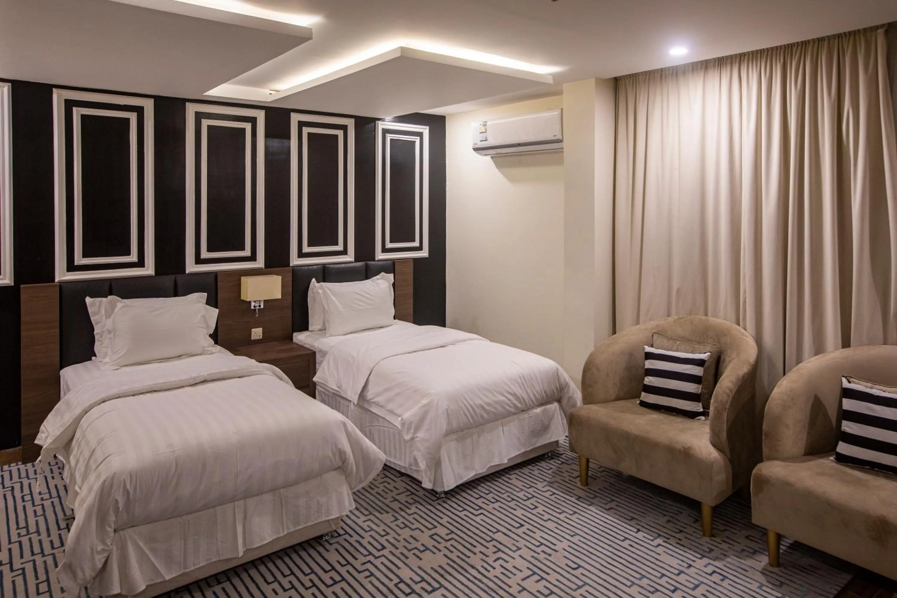 Bed in Olive Tree Hotel