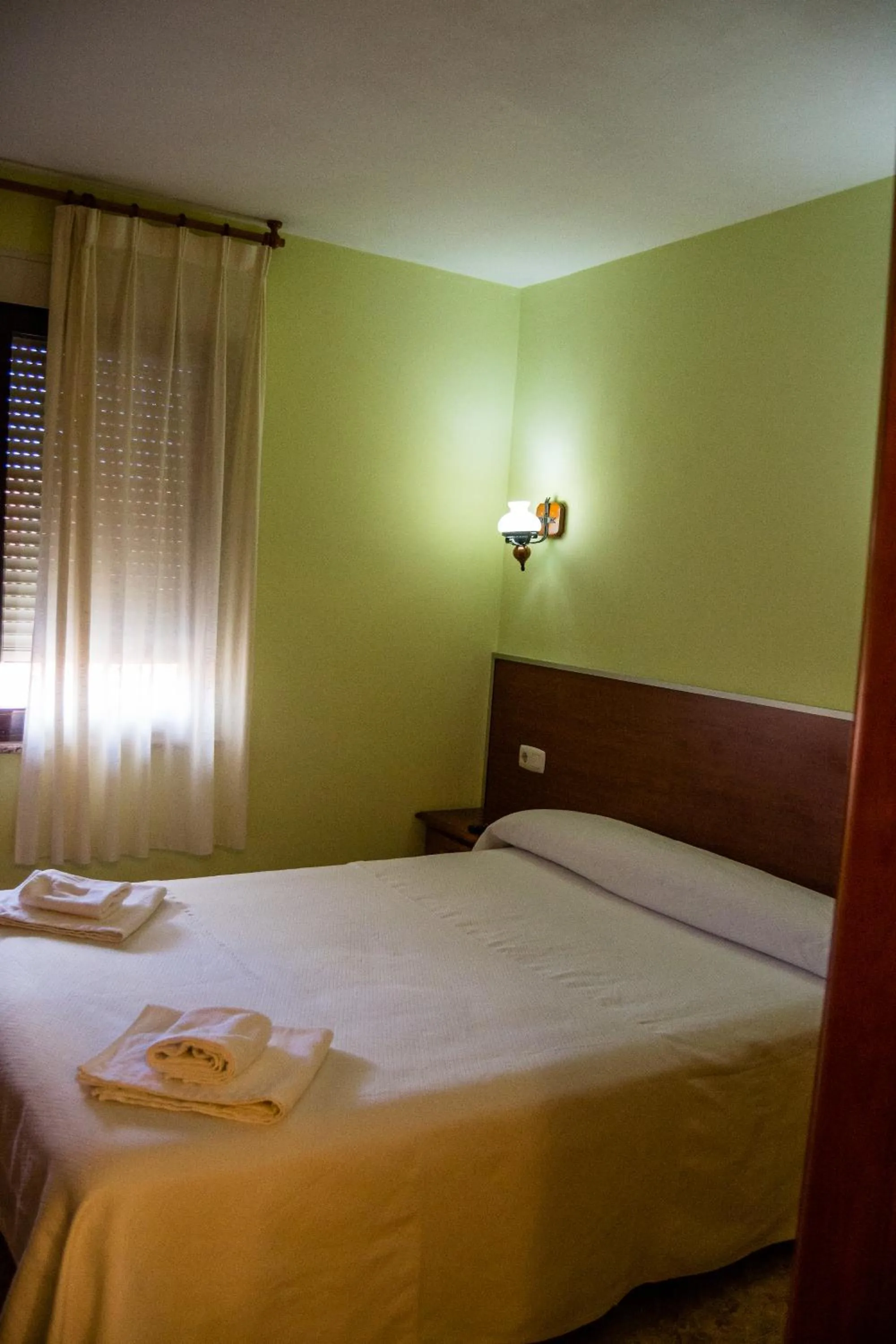 Bed in El Roble Hotel Restaurante