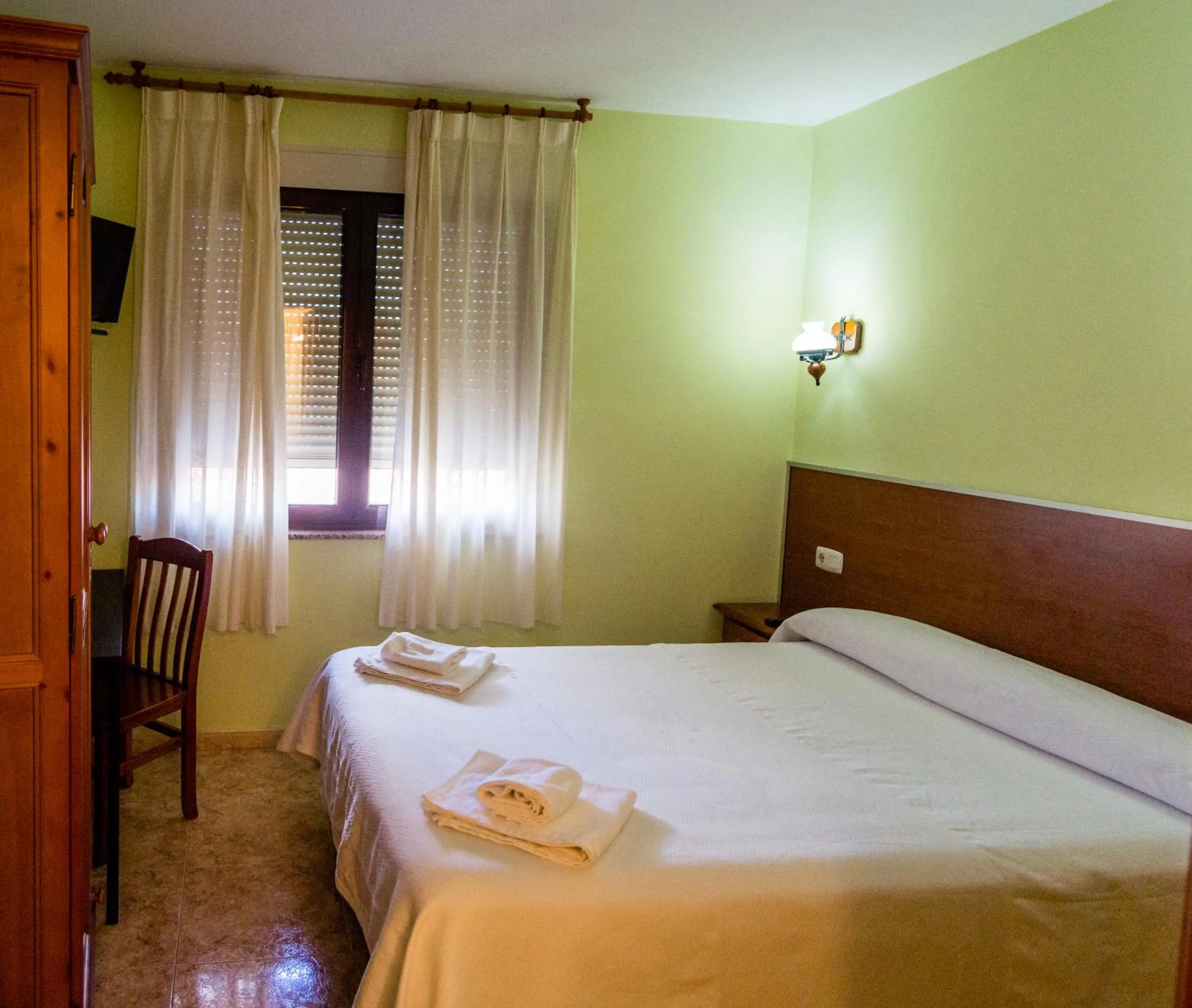 Bed in El Roble Hotel Restaurante