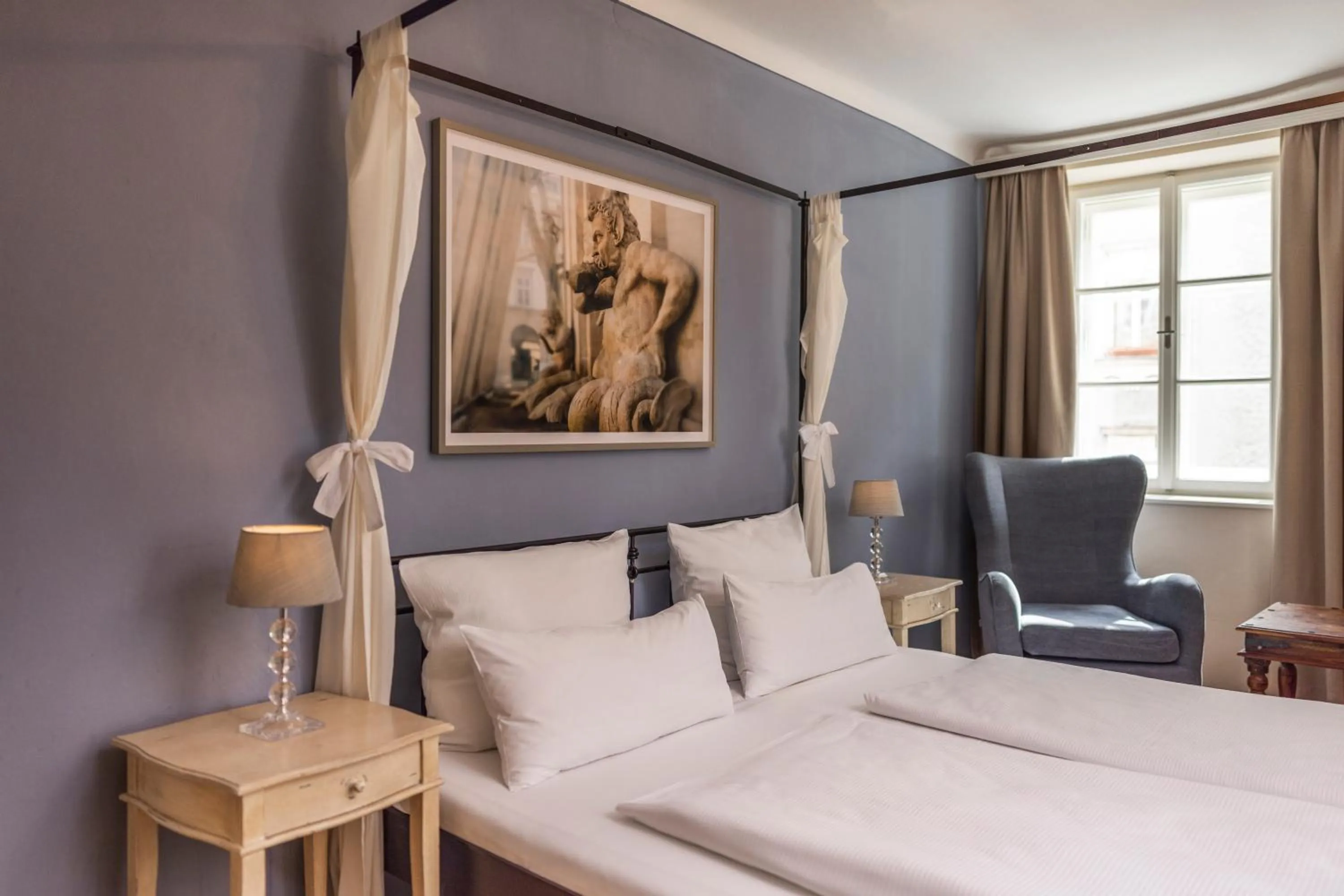 Bed in Boutiquehotel Amadeus