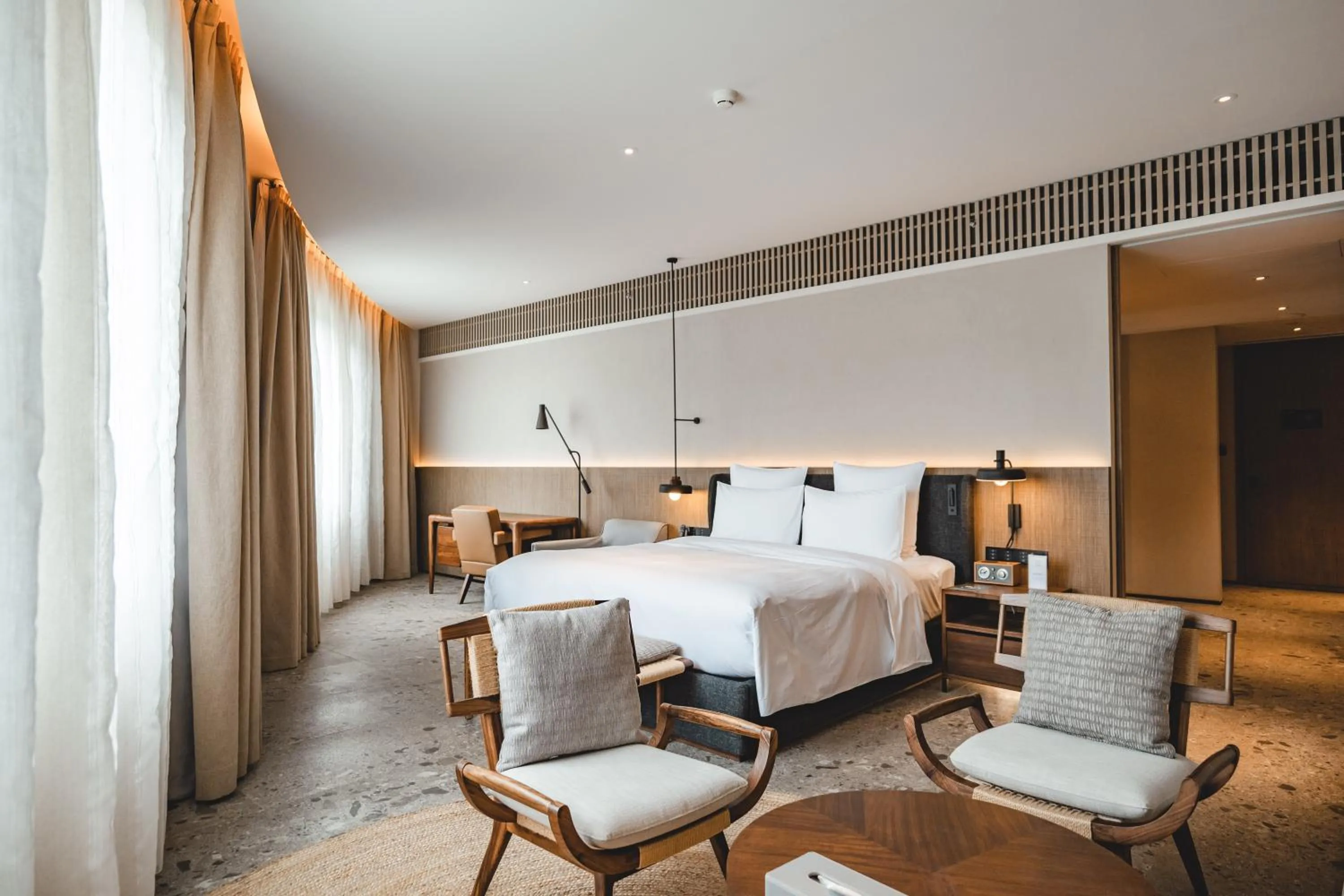 Bedroom, Bed in DongFengYun Hotel Mi'Le - MGallery Collection