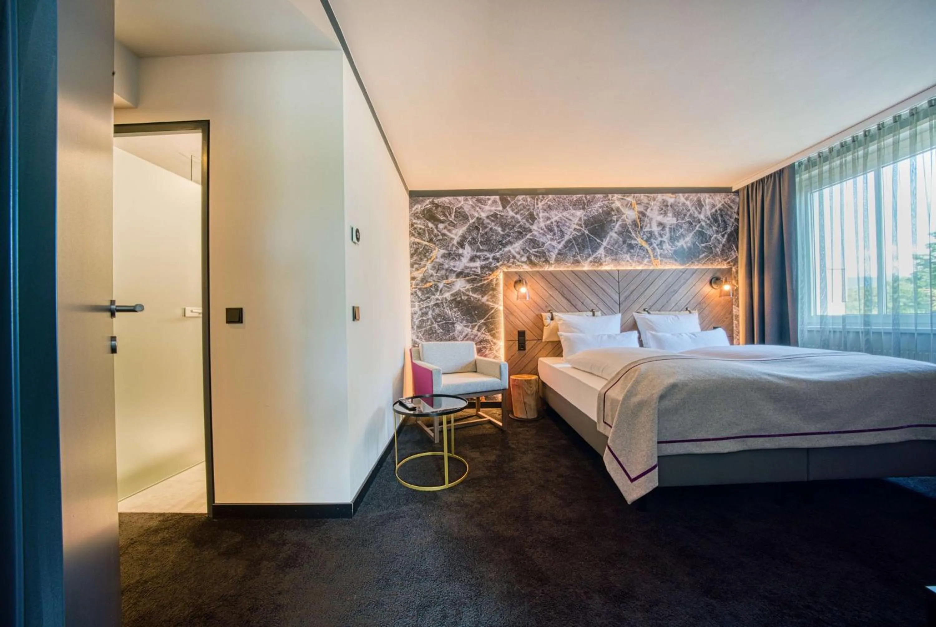 Photo of the whole room, Bed in FourSide Hotel Salzburg Messe, Trademark Collection by Wyndham