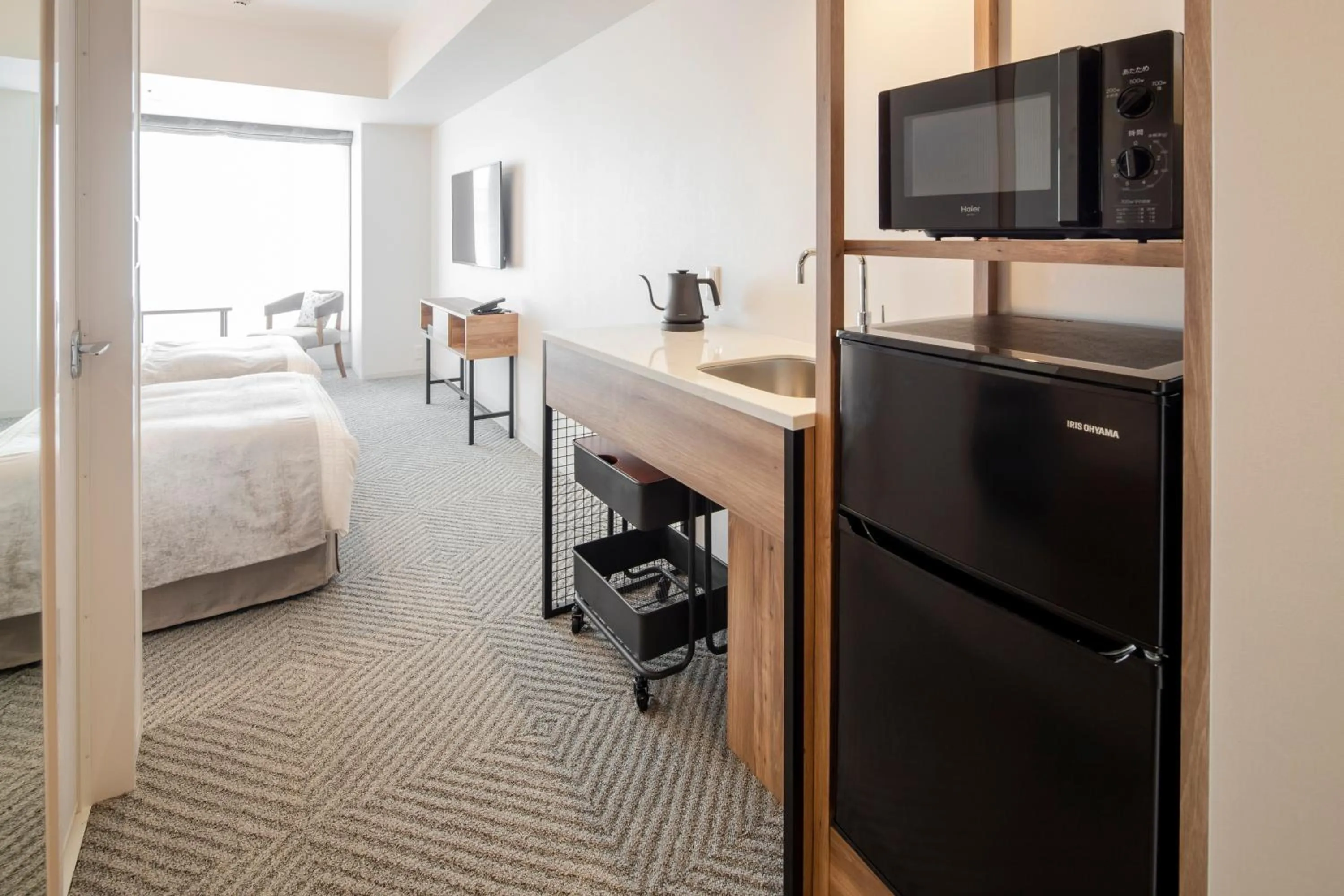 Kitchen or kitchenette, Bed in Tokyu Stay Shinjuku Eastside