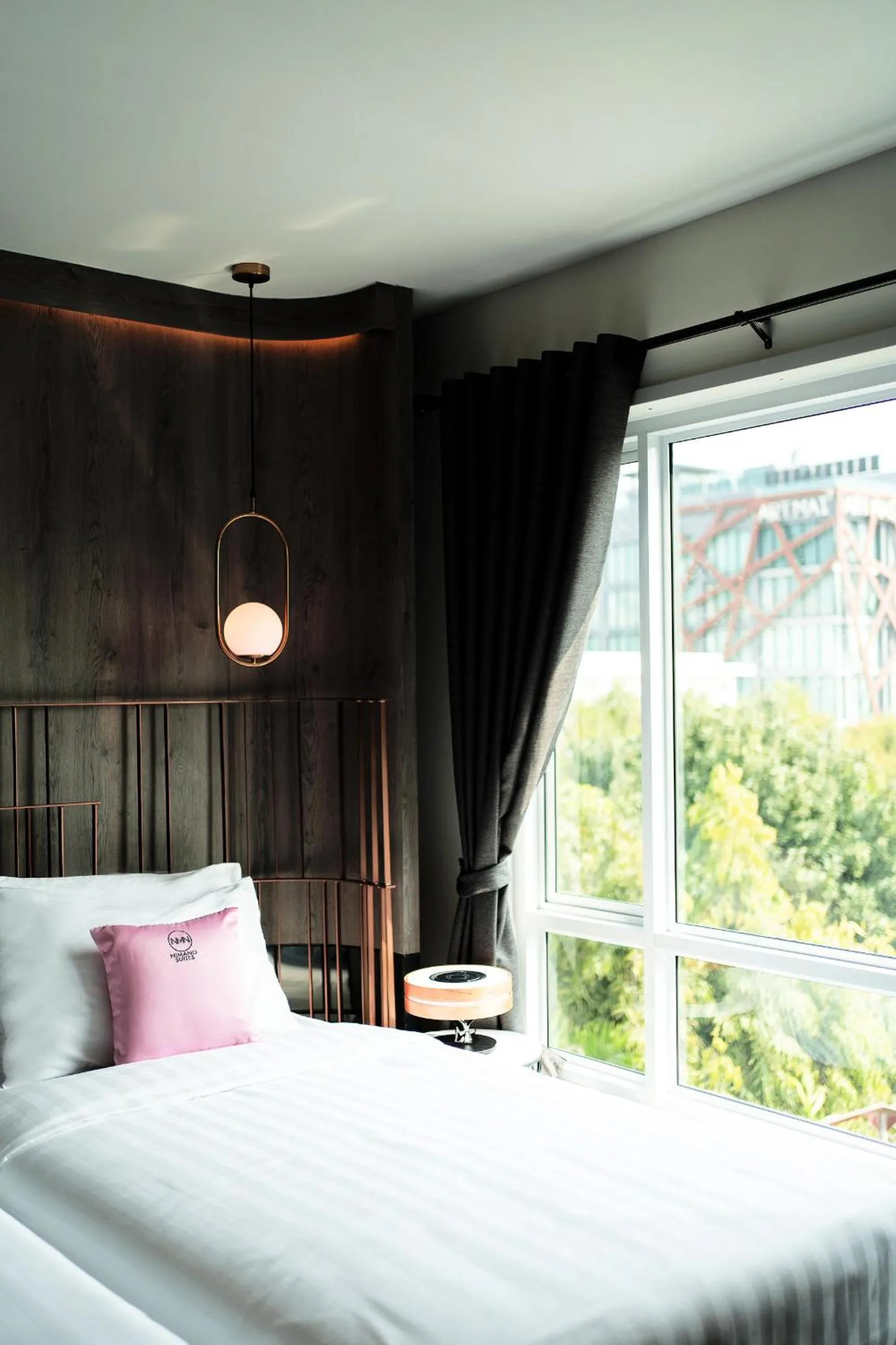 Bed in NIMANO SUITES