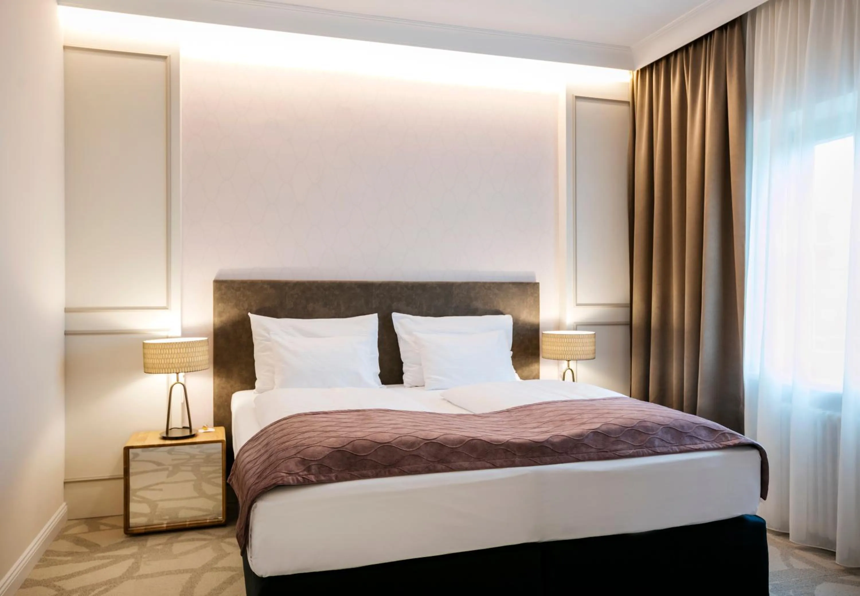 Bed in ARCOTEL Castellani Salzburg