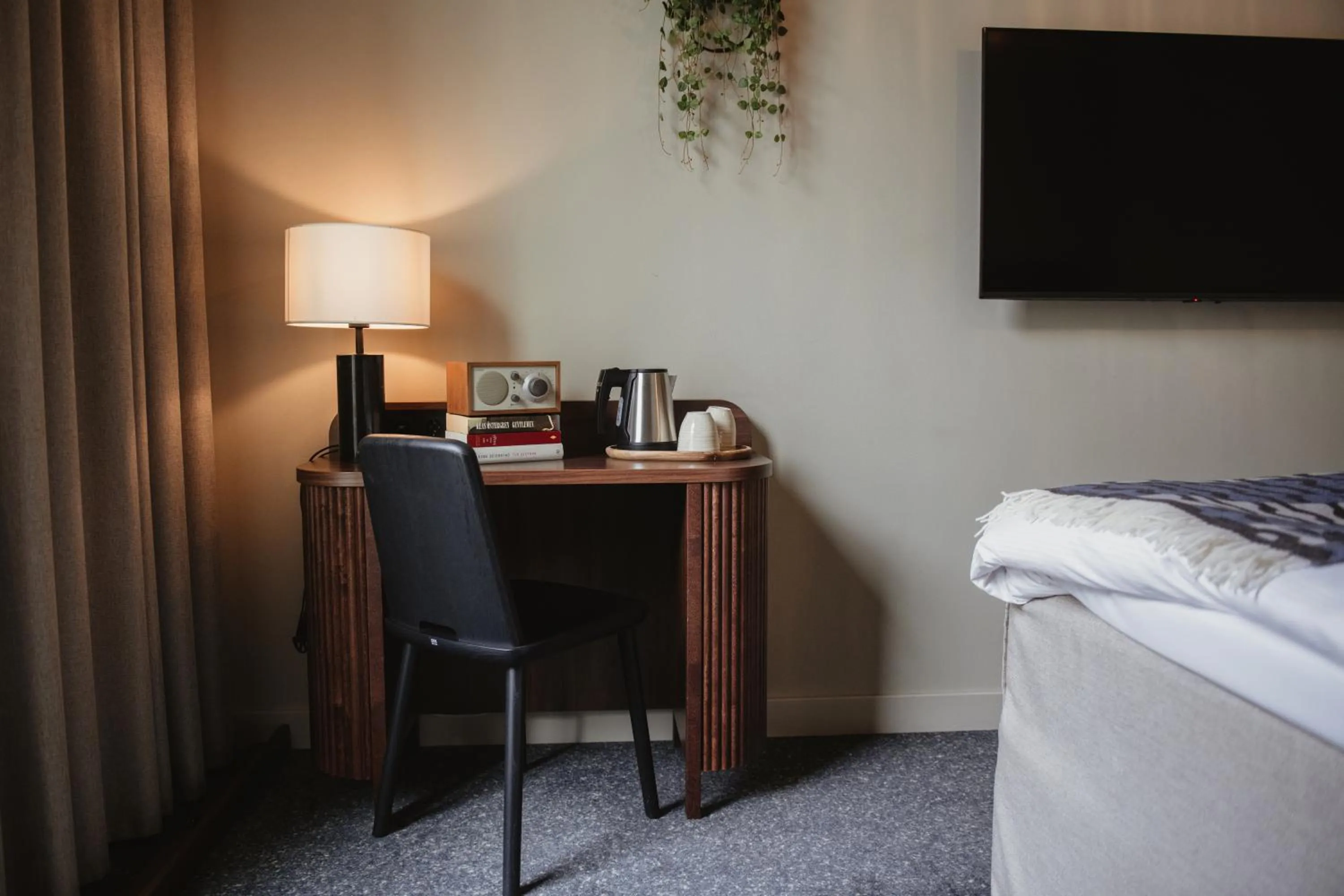 Seating area, Bed in Home Hotel Tapetfabriken