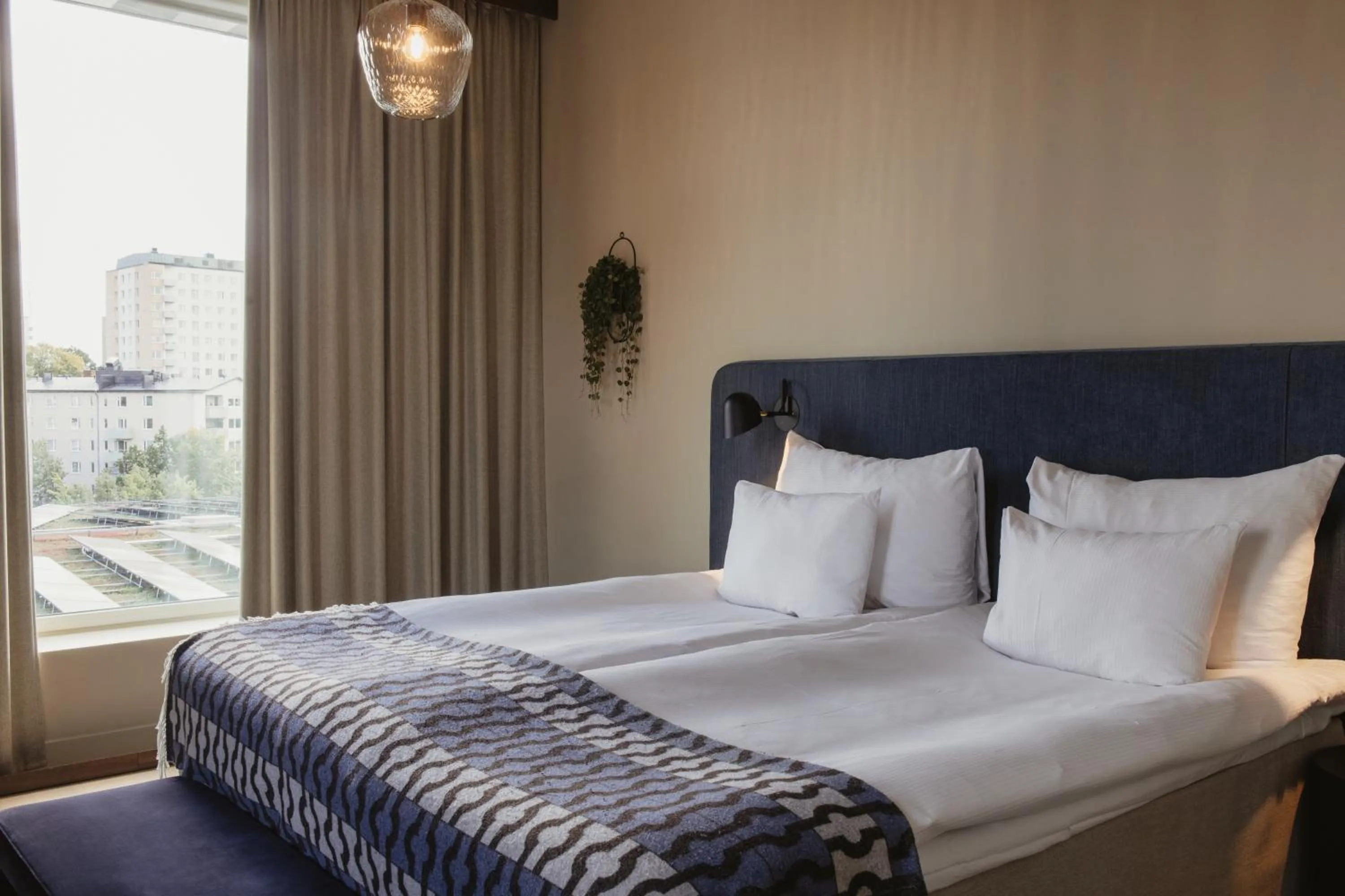 Bed in Home Hotel Tapetfabriken