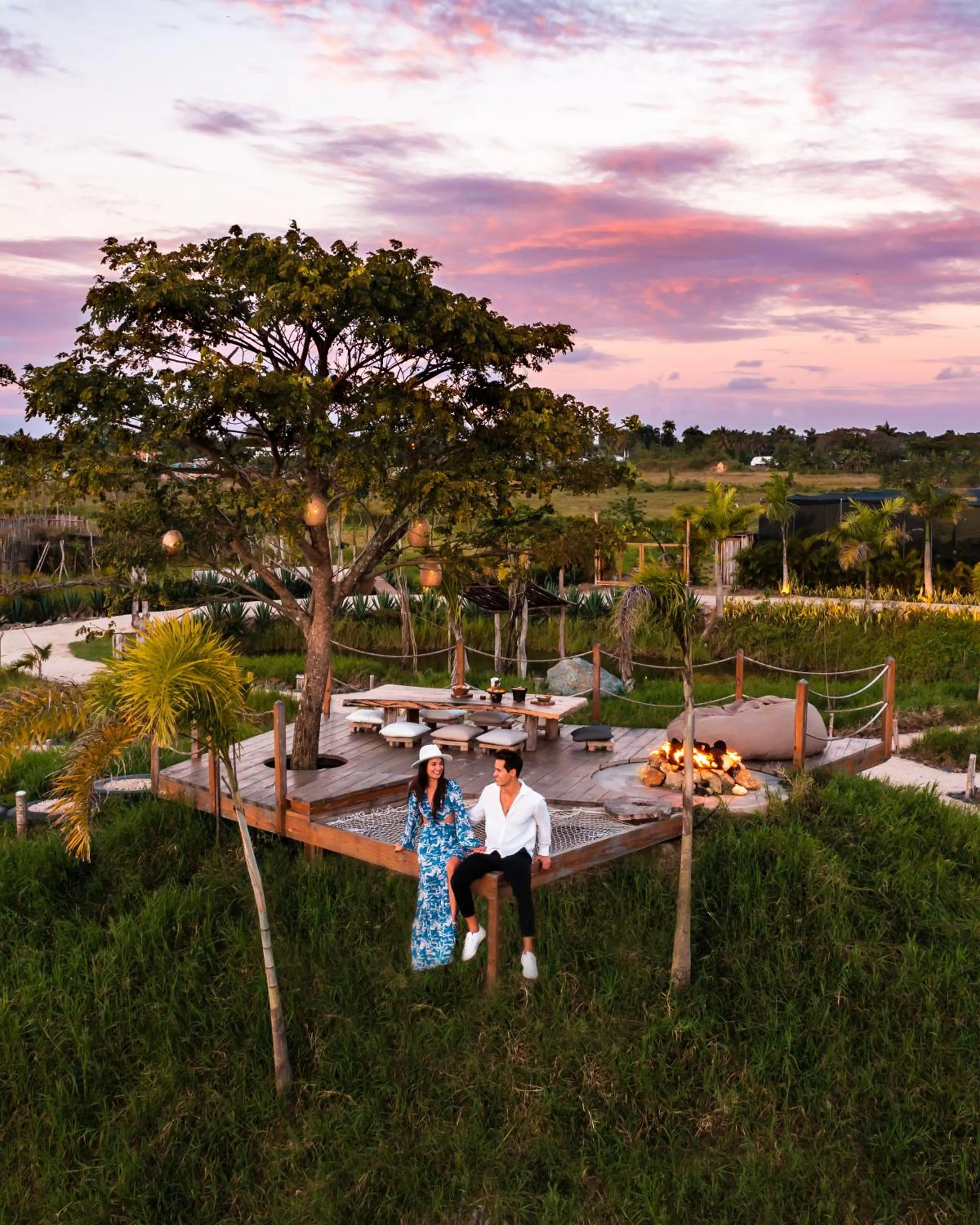 People in Green Land Bubble Glamping