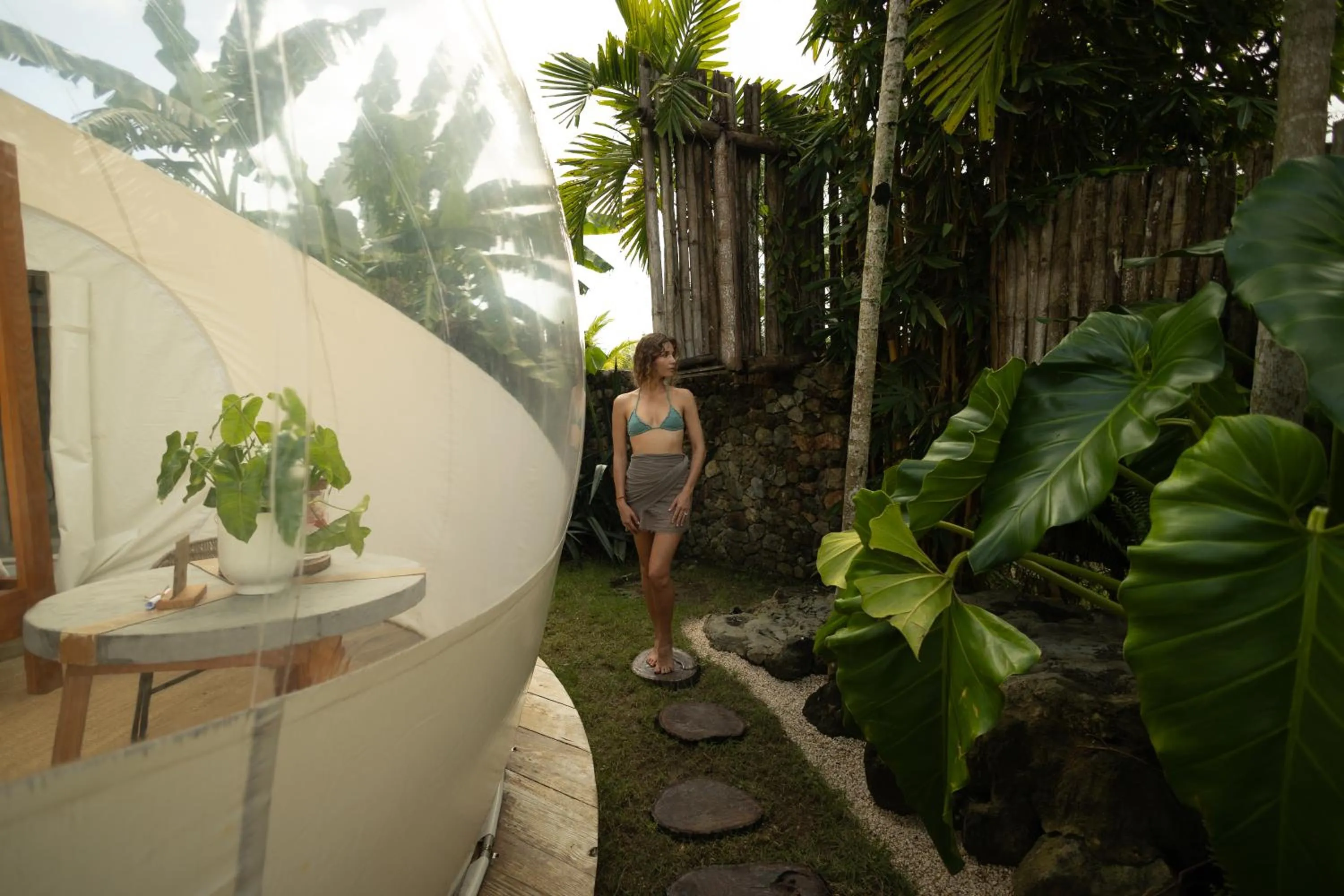 People in Green Land Bubble Glamping