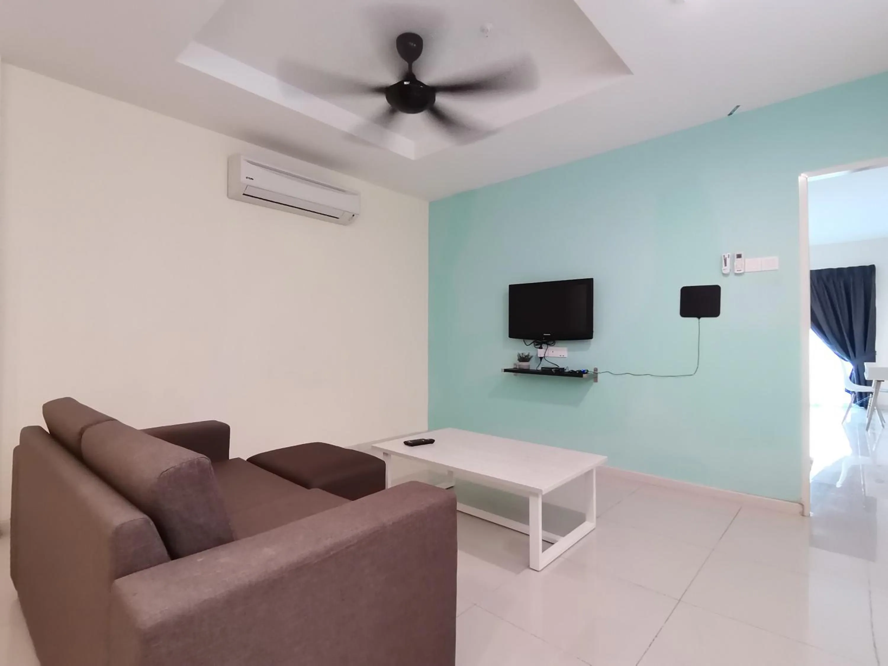 Living room in Marina Island Lumut Homestay by Goopro