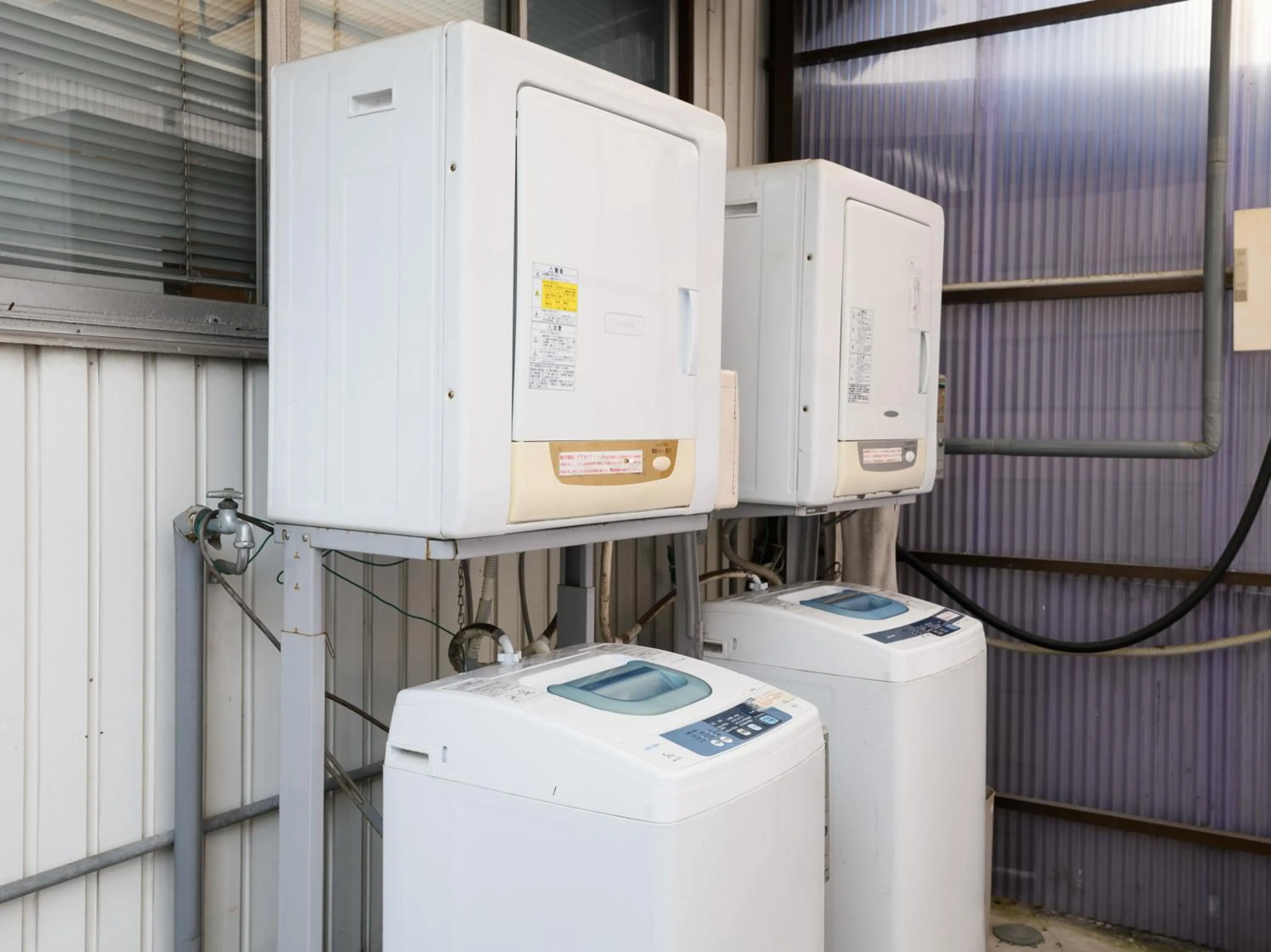 washing machine in Tabist Kameyama Daiichi Hotel