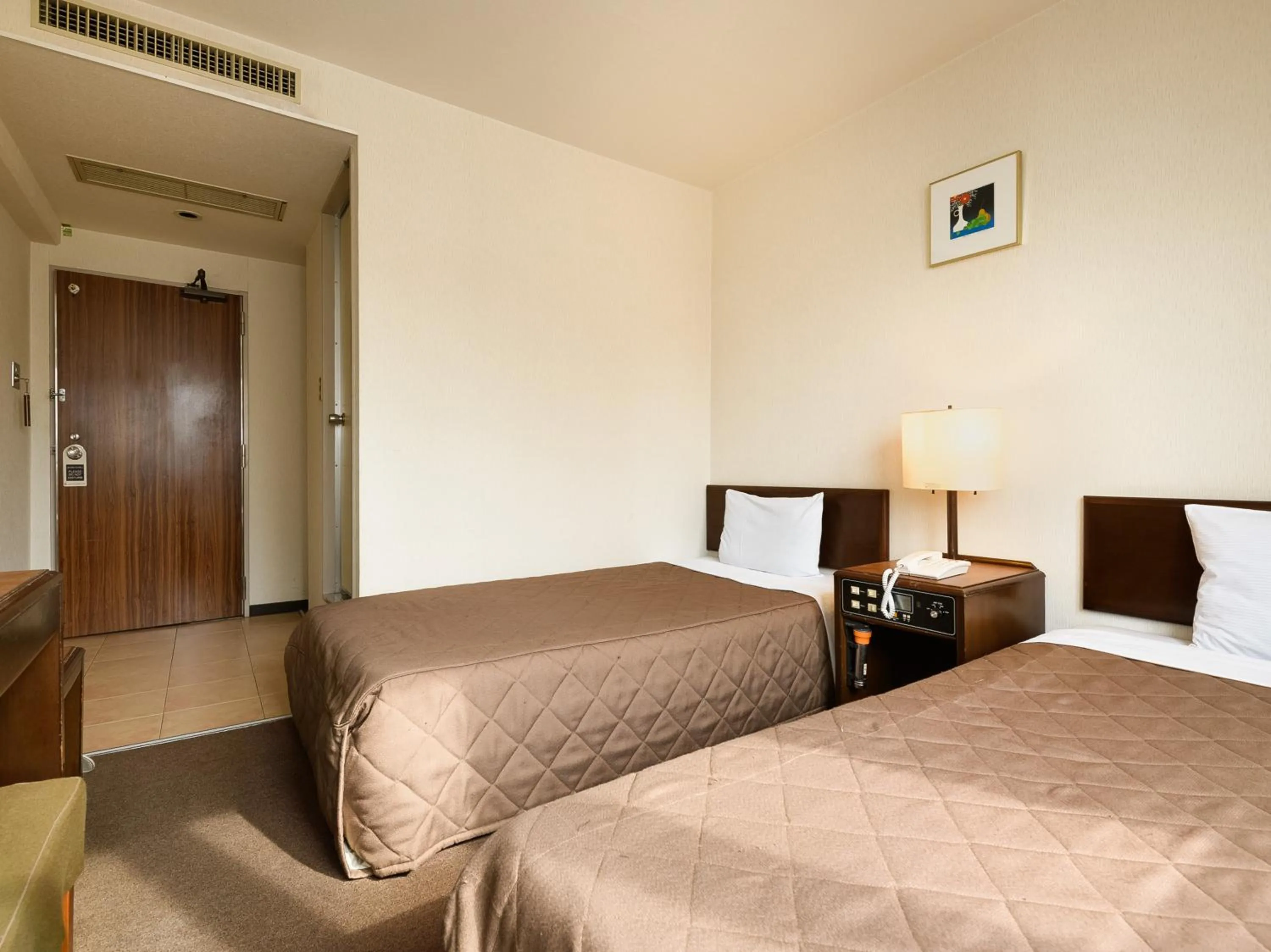 Bed in Tabist Kameyama Daiichi Hotel