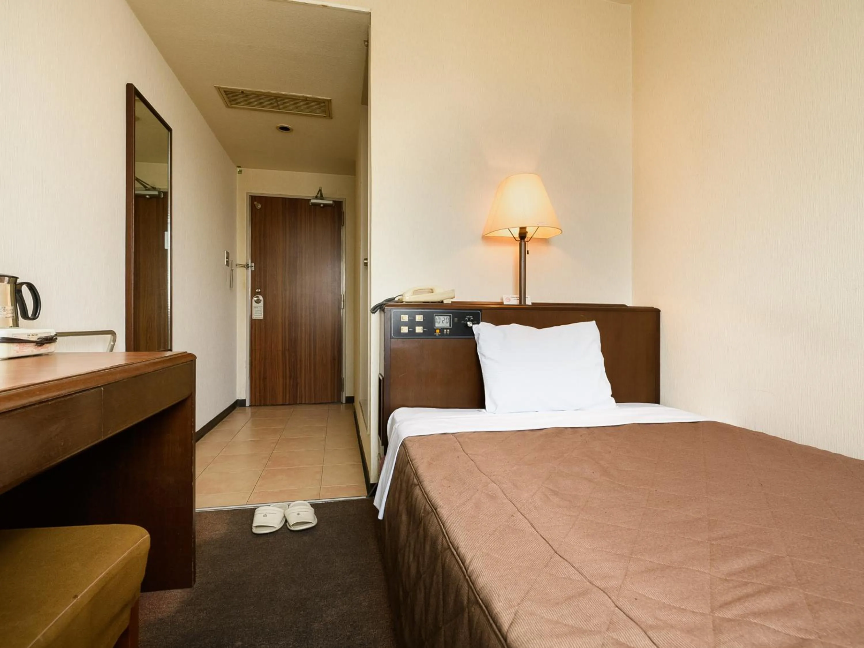 Bed in Tabist Kameyama Daiichi Hotel