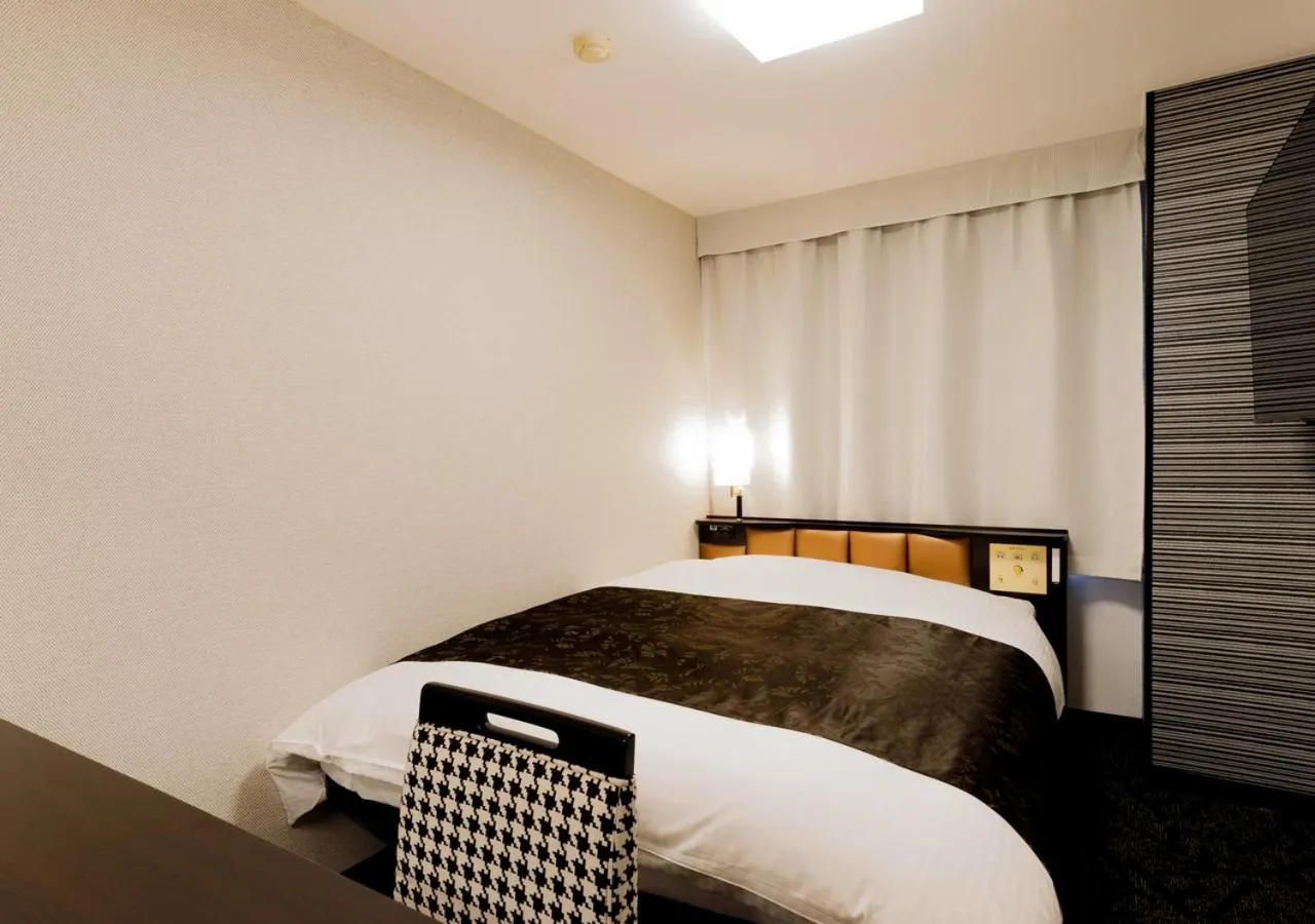 Photo of the whole room, Bed in APA Hotel Kokuraeki Shinkansenguchi