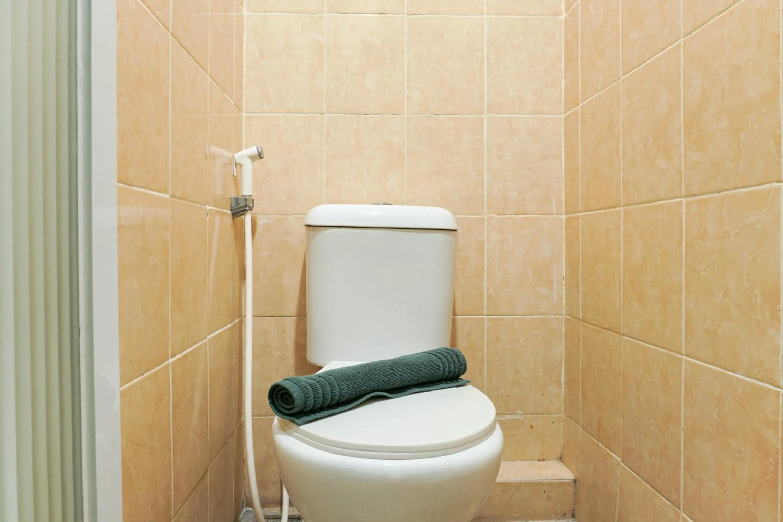 Bathroom in Beautiful and Comfy 2BR Menteng Square Apartment By Travelio