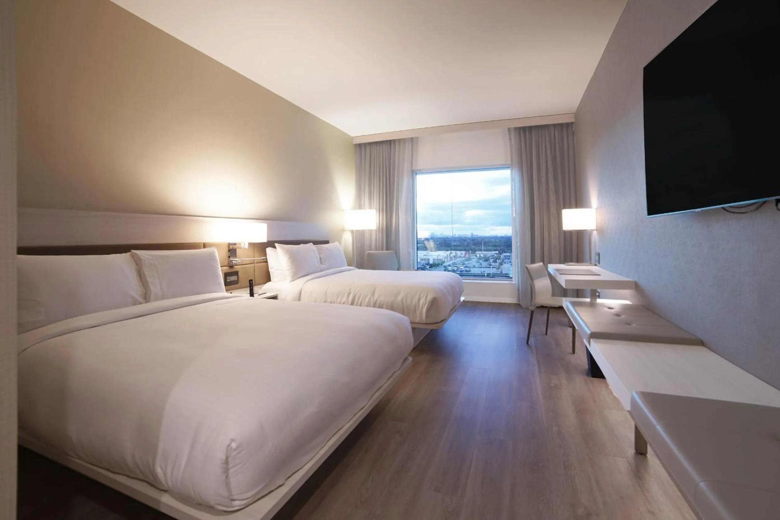 Bed in AC Hotel by Marriott Fort Lauderdale Airport