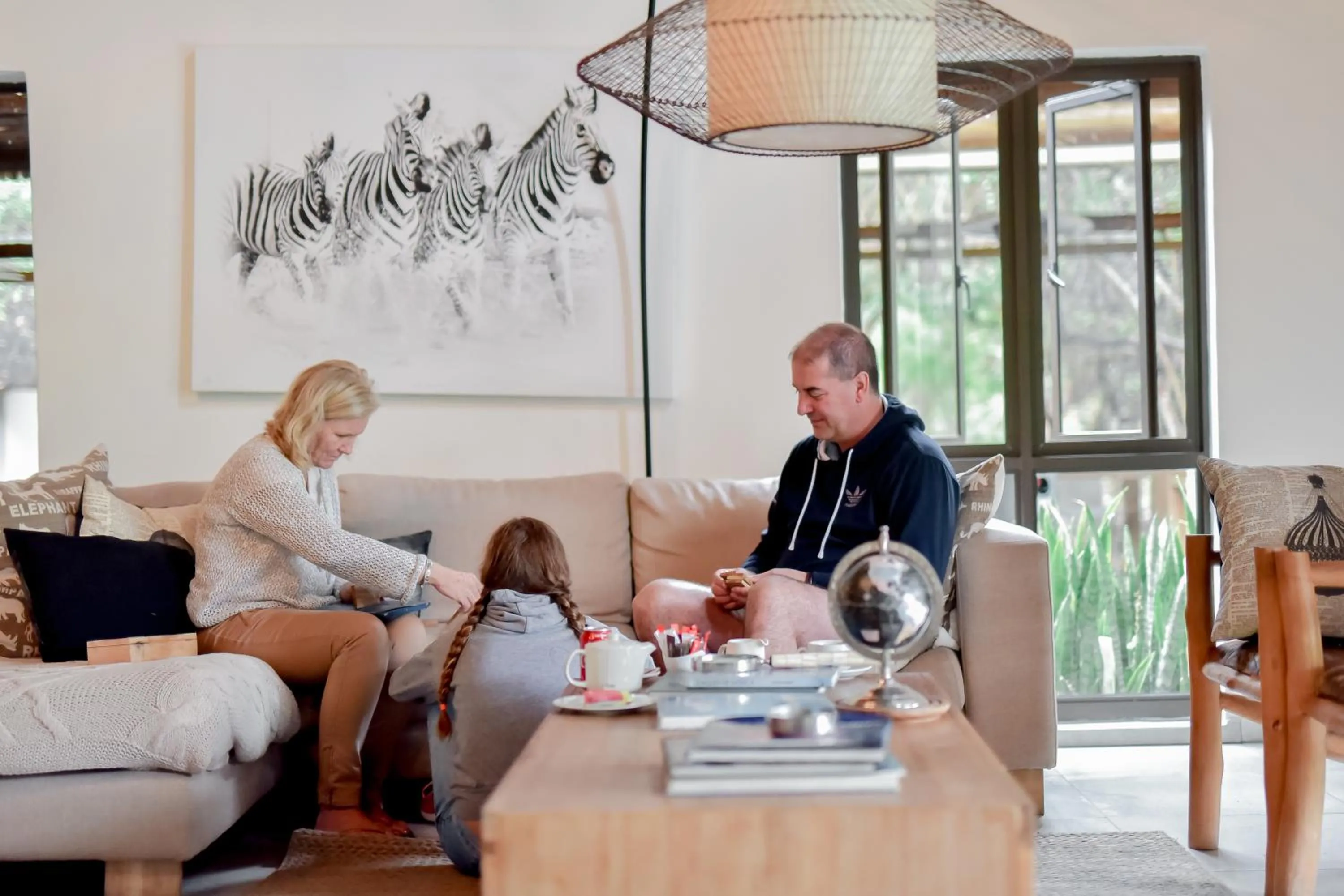 Communal lounge/ TV room in Moditlo River Lodge