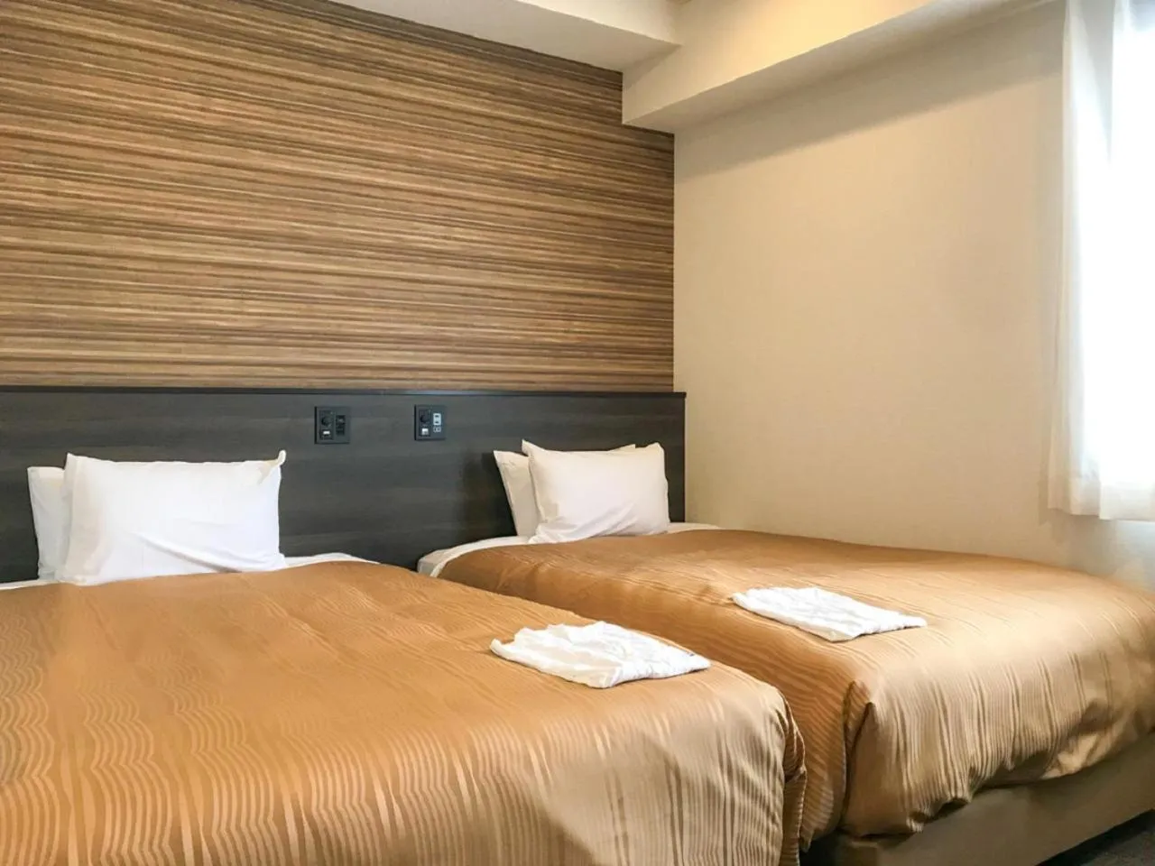 Bed in HOTEL LiVEMAX Sendai Kokubuncho