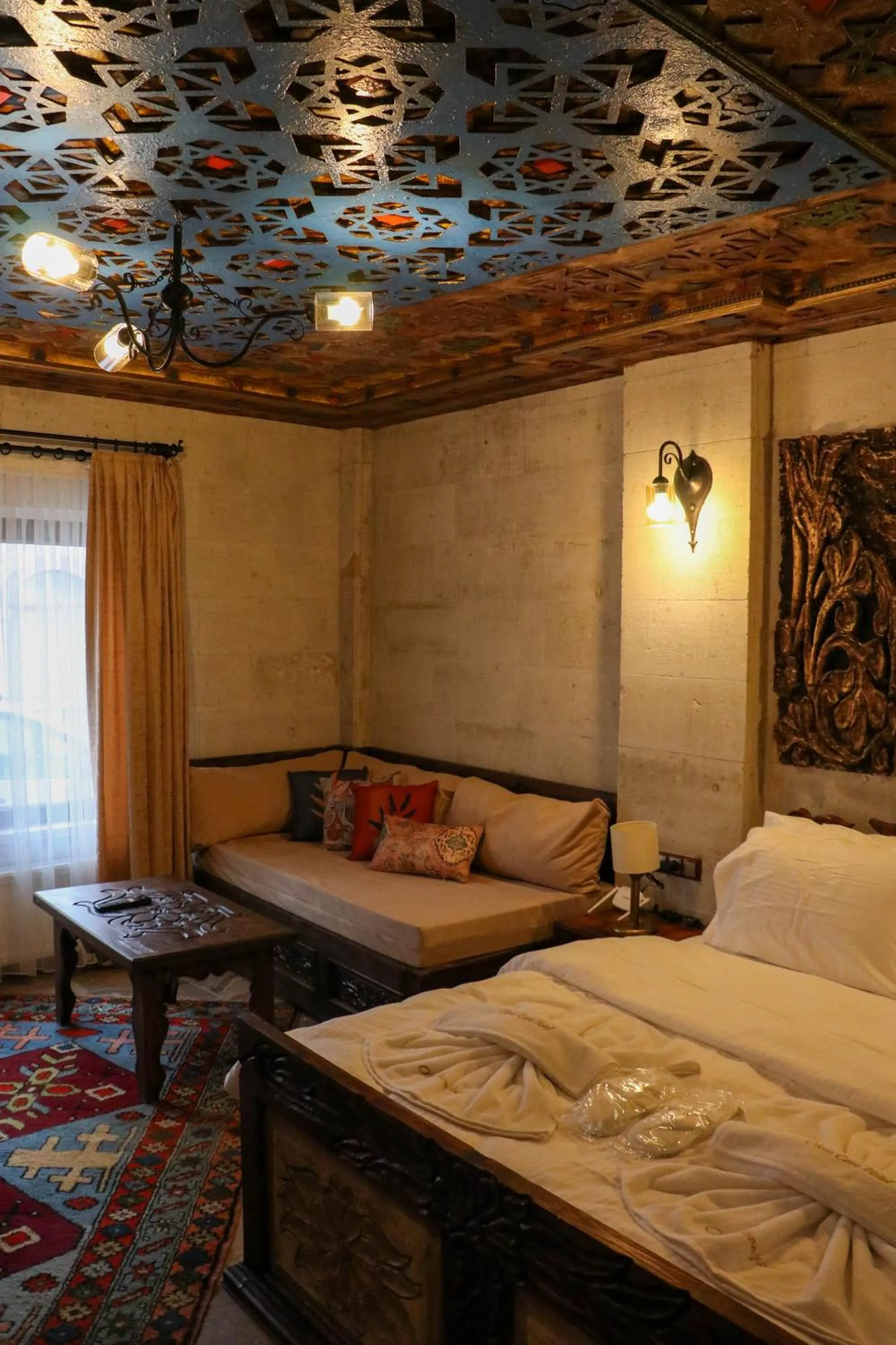 Seating area, Bed in Olivia Cave Hotel