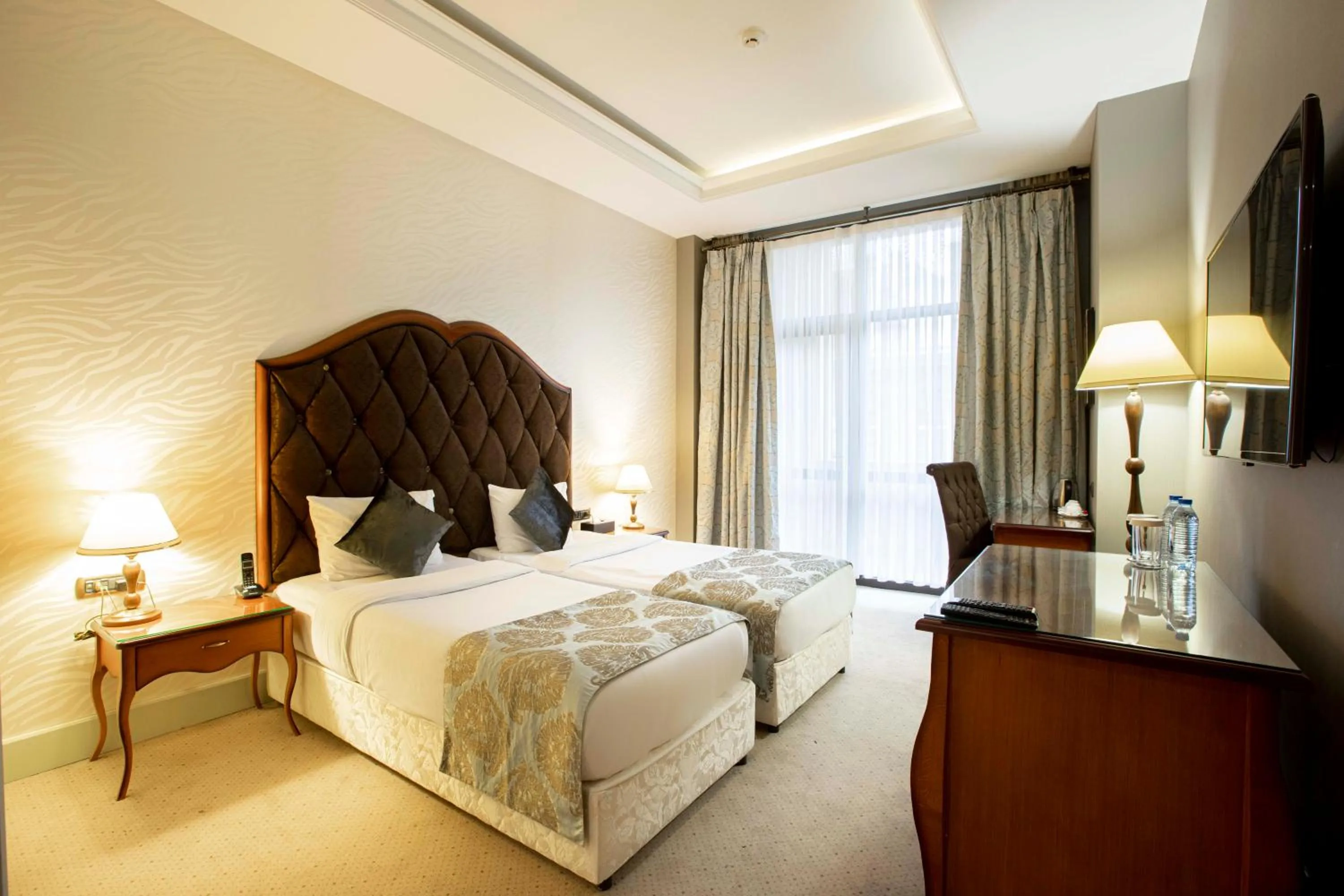 Bed in Sapphire Inn Hotel