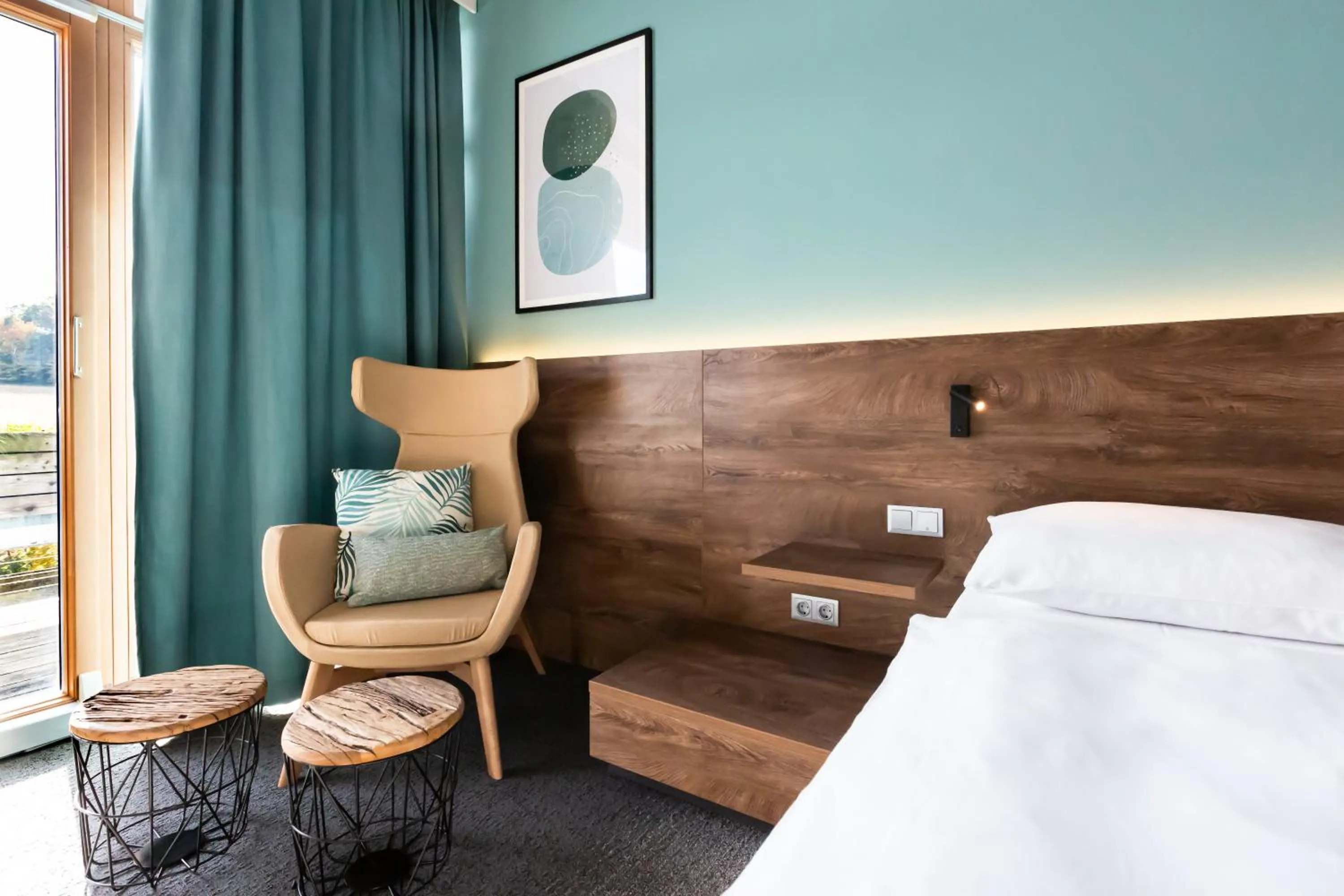 Living room, Bed in Das Sonnreich - Thermenhotel Loipersdorf