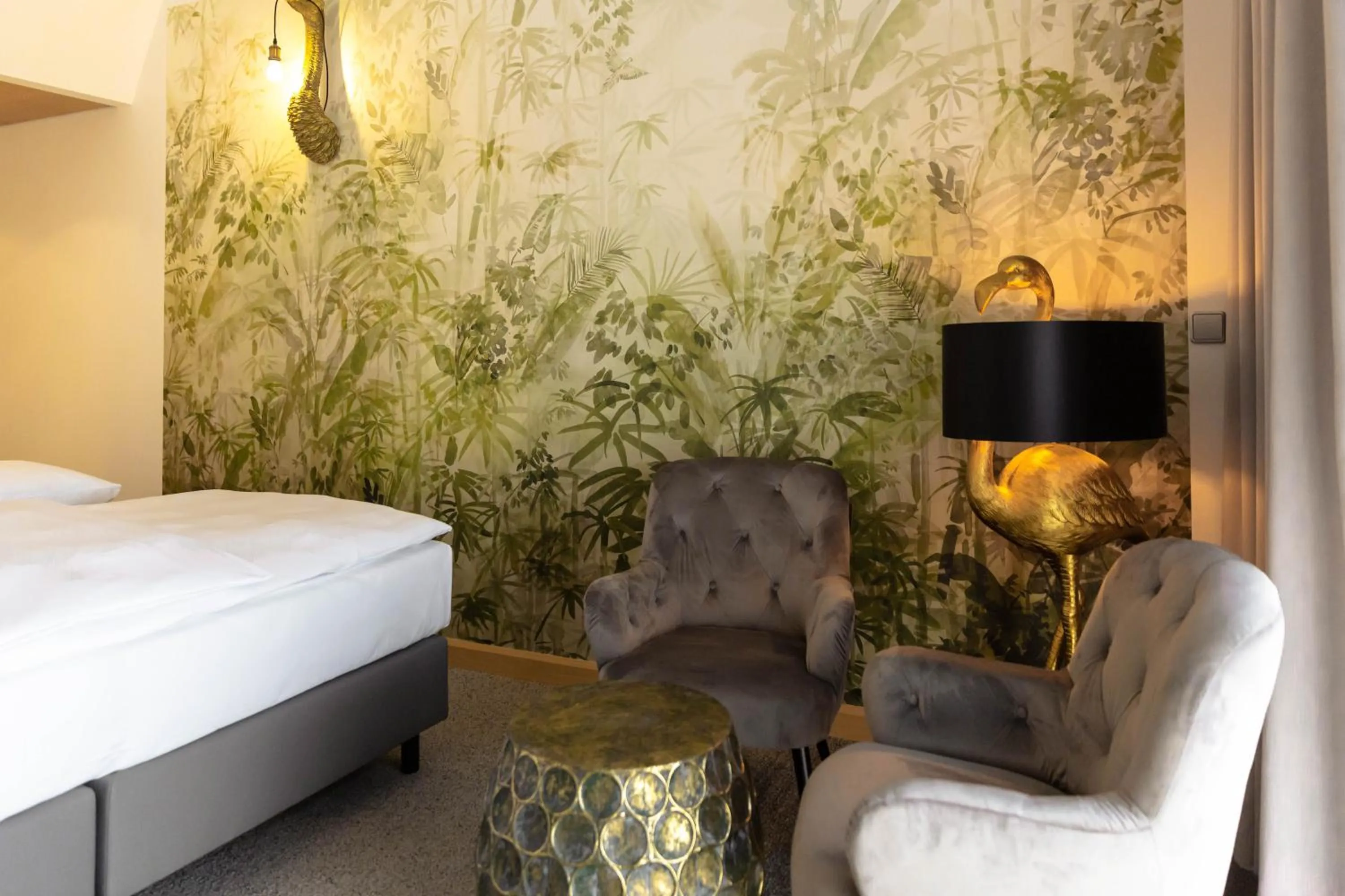 Living room, Bed in Das Sonnreich - Thermenhotel Loipersdorf