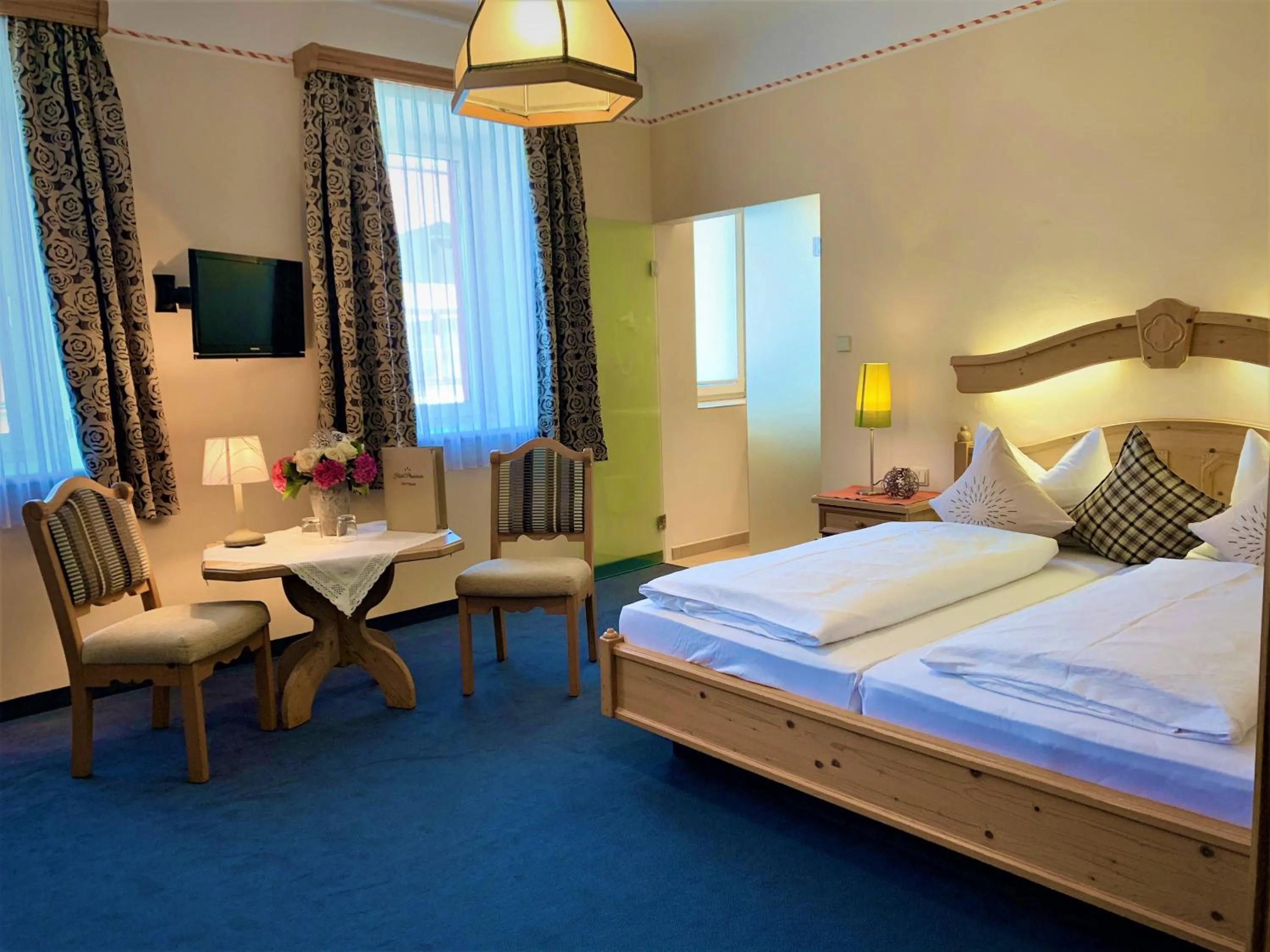 Photo of the whole room, Bed in Hotel Plainbrücke | self check-in