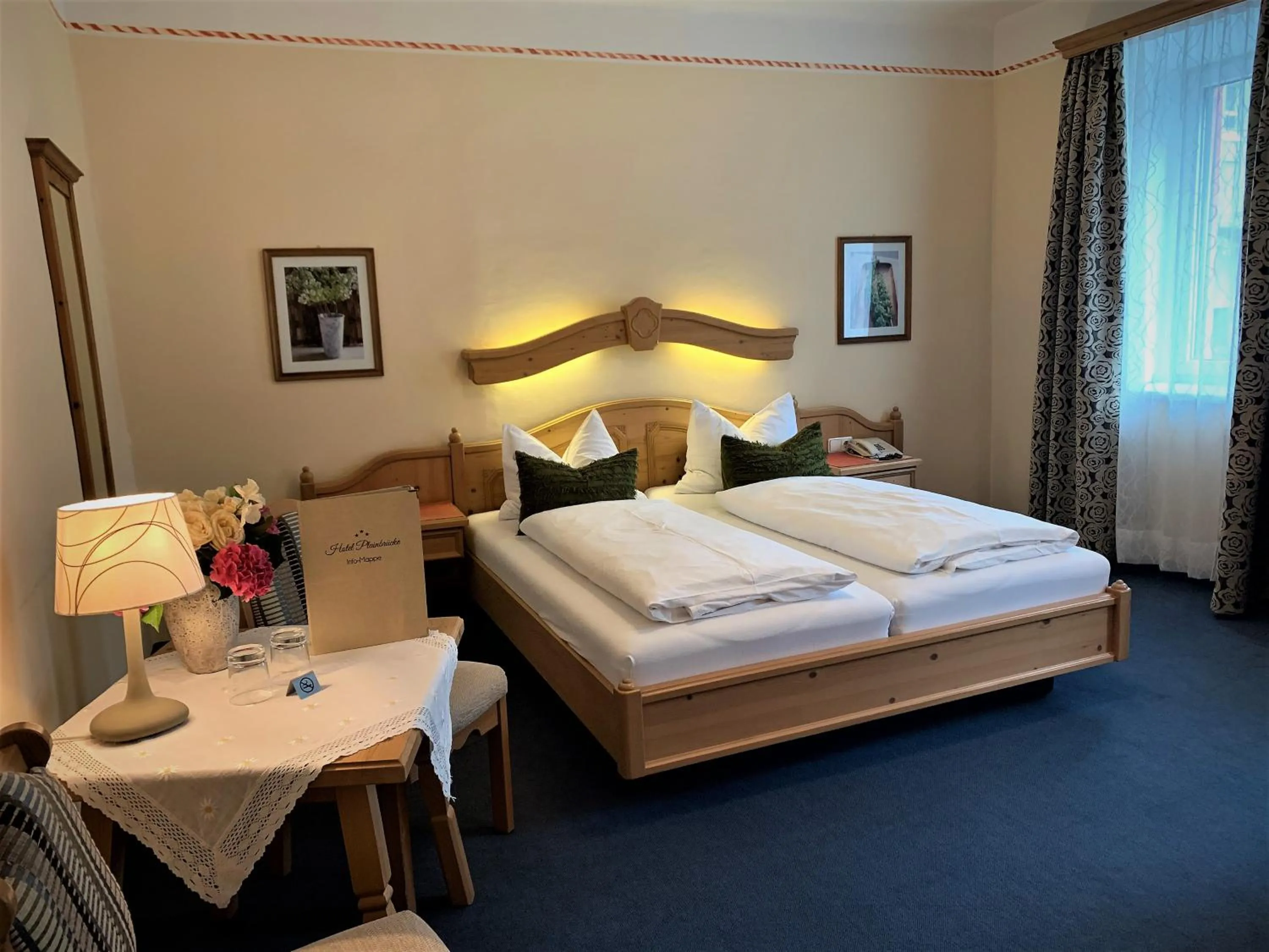 Photo of the whole room, Bed in Hotel Plainbrücke | self check-in