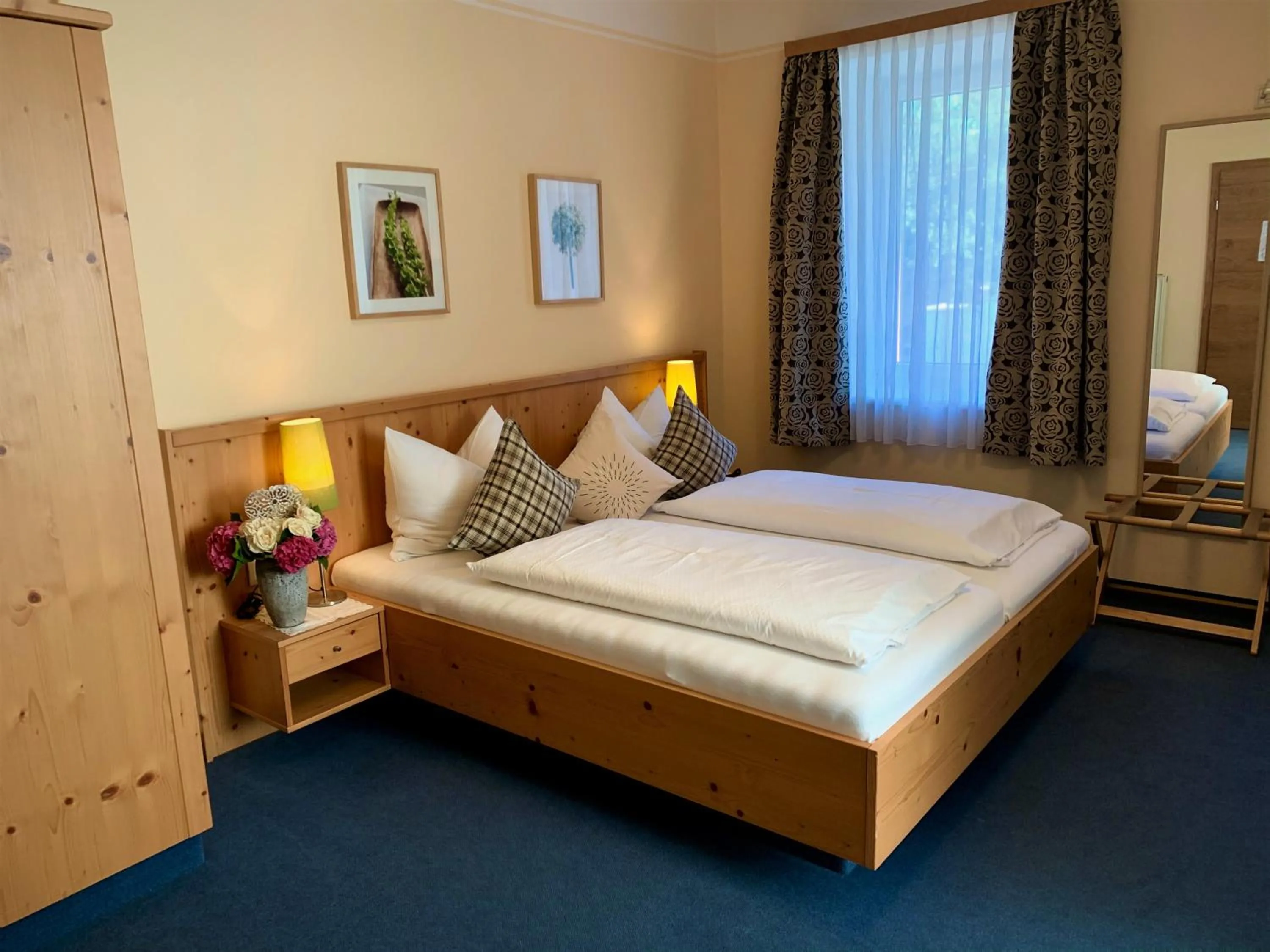 Photo of the whole room, Bed in Hotel Plainbrücke | self check-in