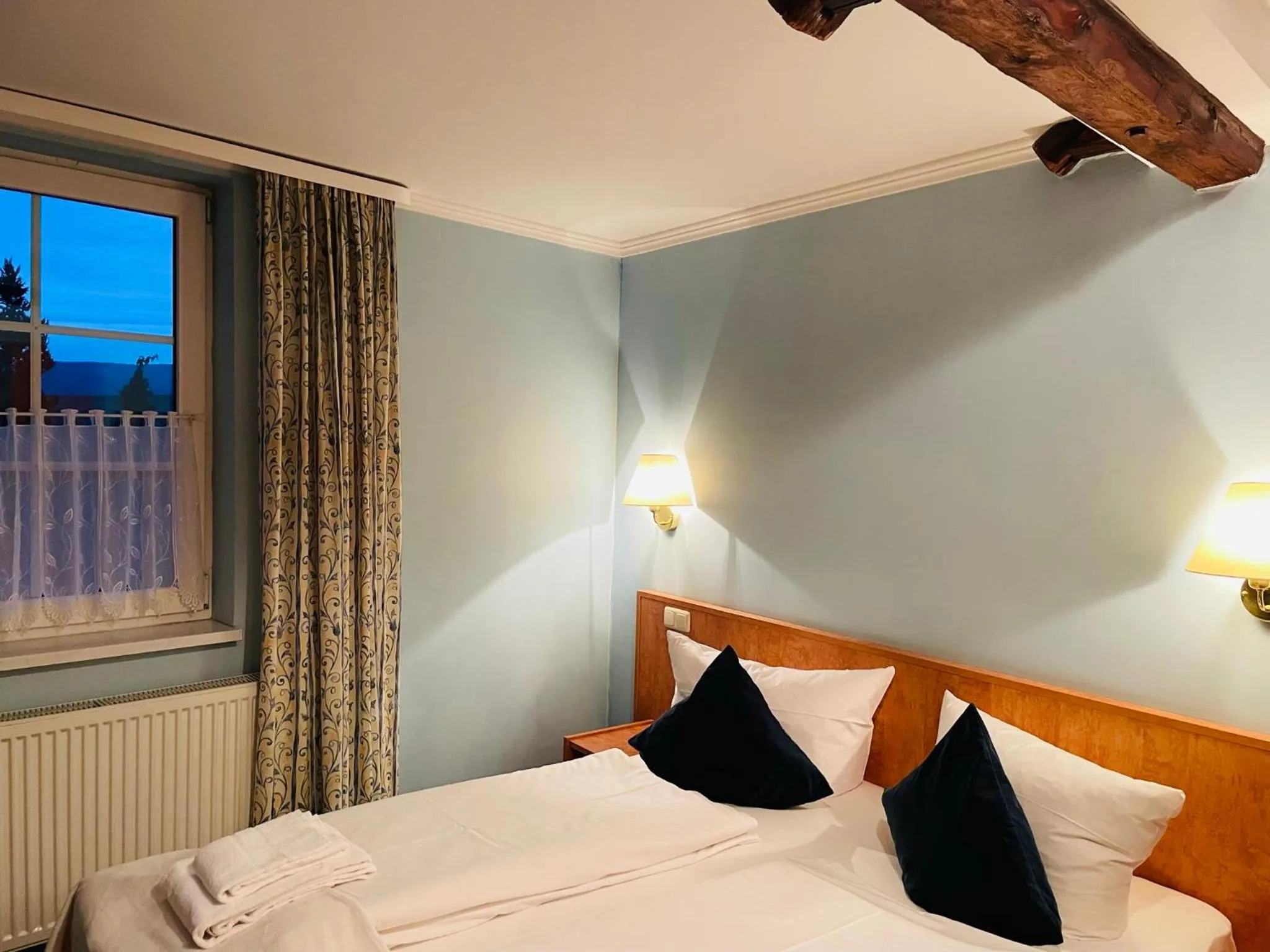 Bed in Harzhotel Warnstedter Krug