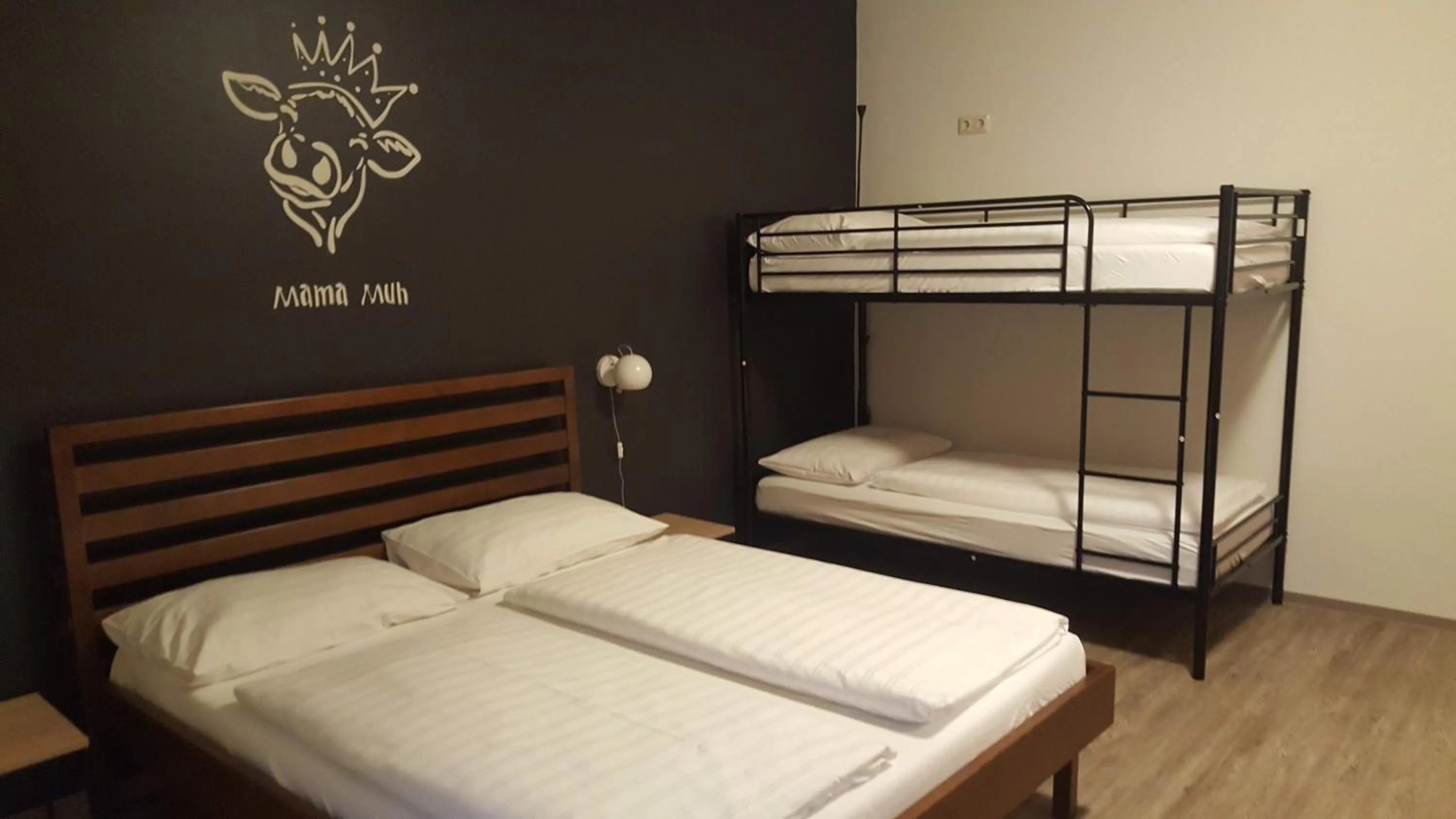 Photo of the whole room, Bed in Mama Muh Self-Check-in