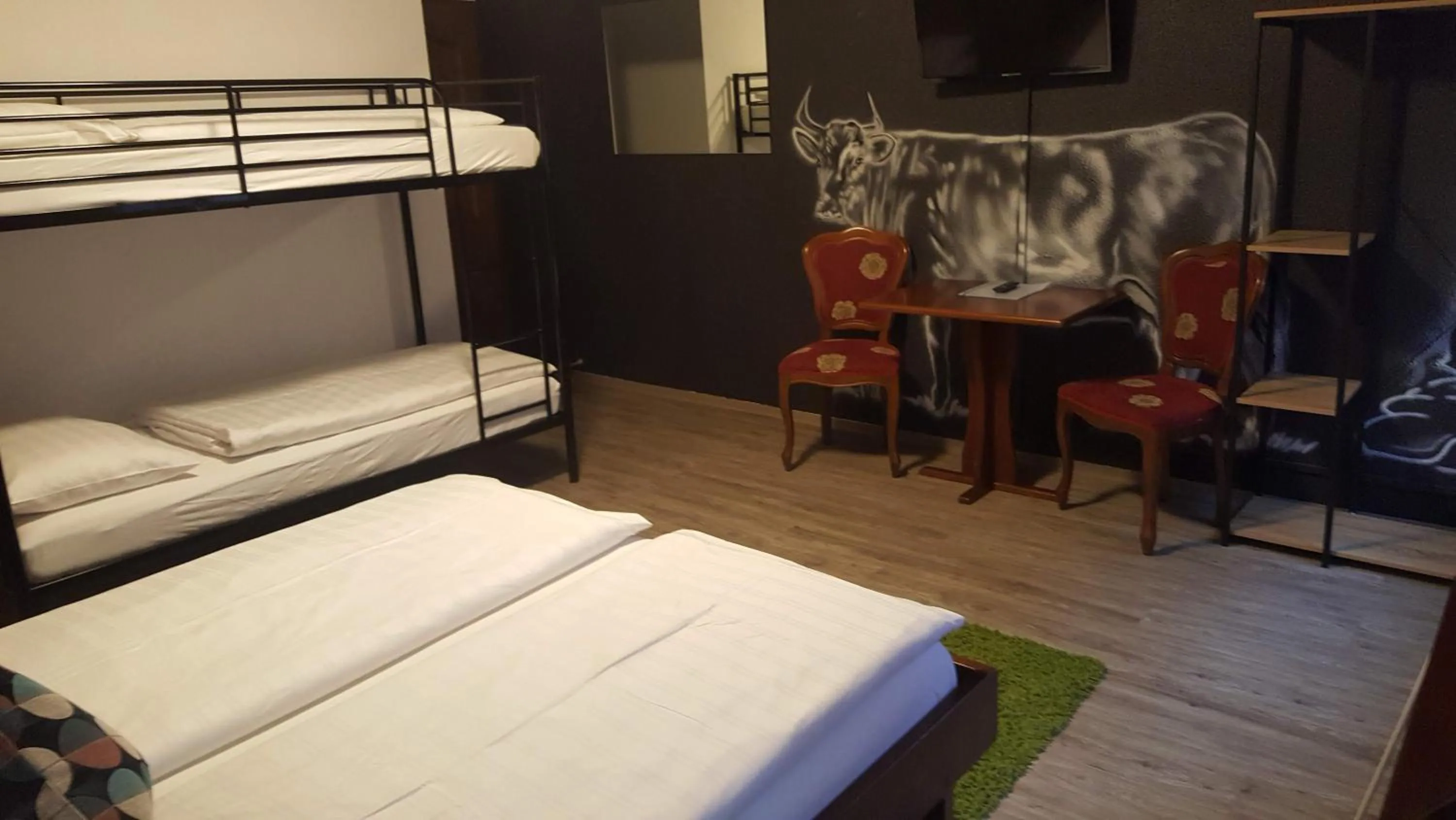 Photo of the whole room, Bed in Mama Muh Self-Check-in