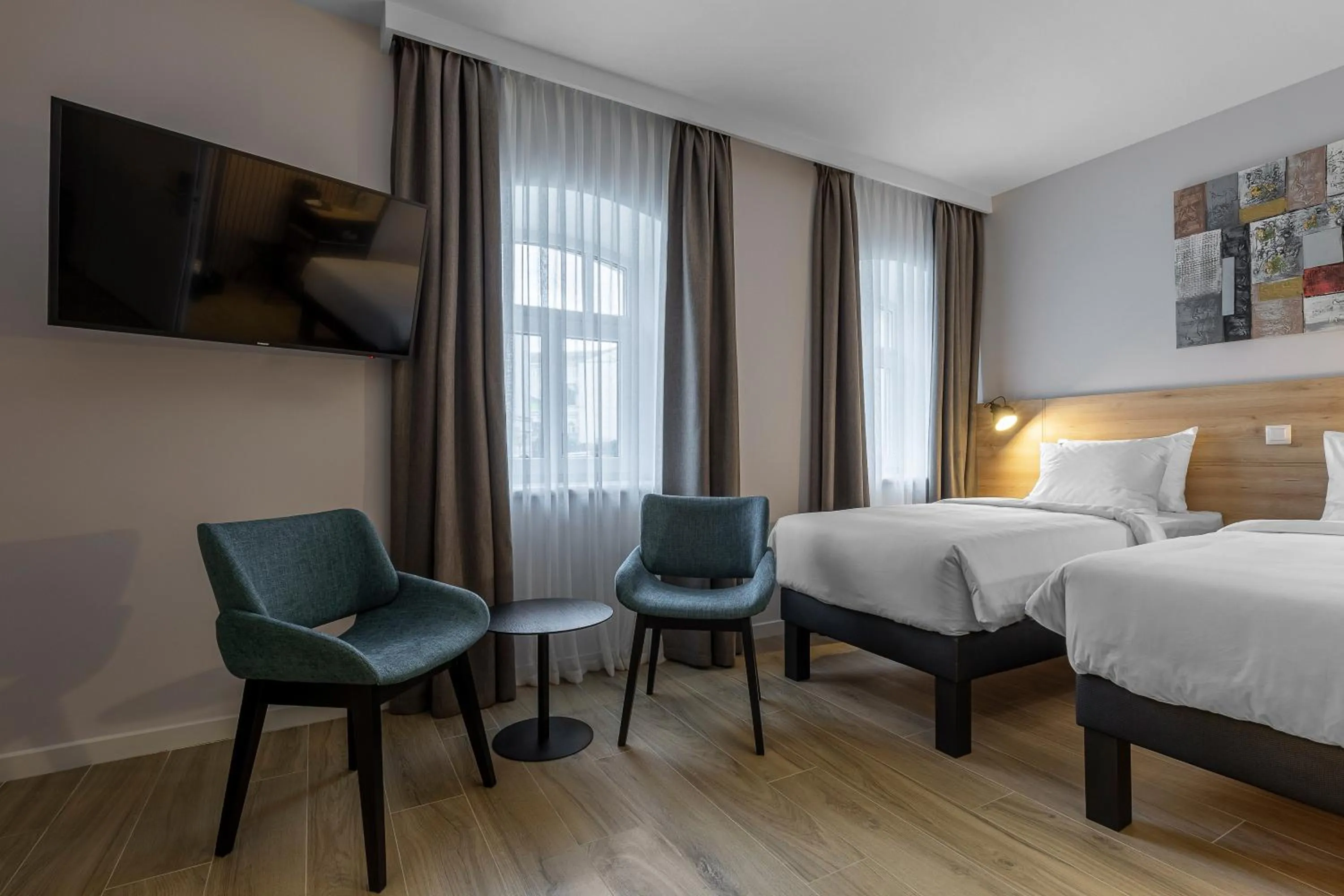 Bed in KONTRAKT Boutique Hotel