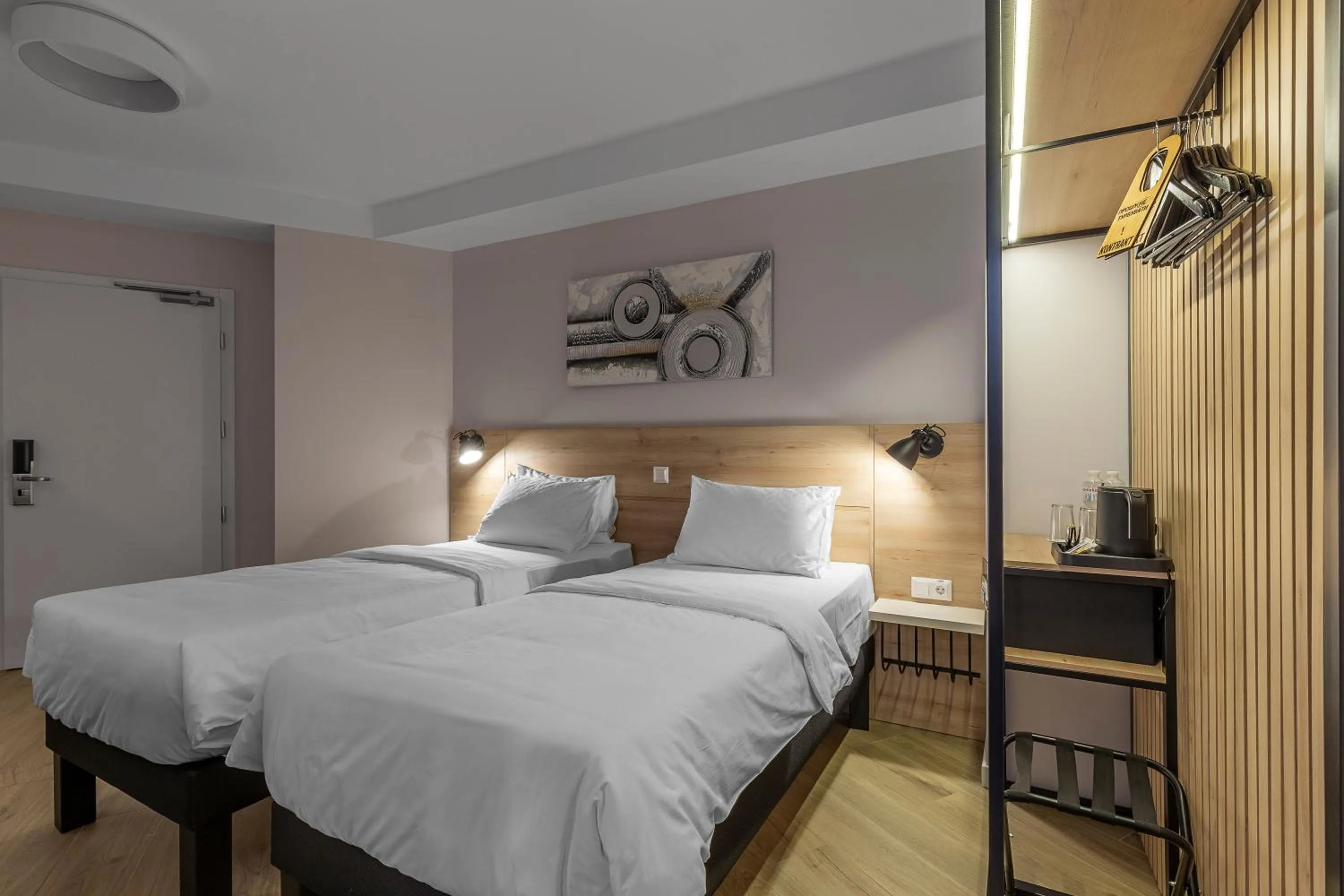 Bed in KONTRAKT Boutique Hotel