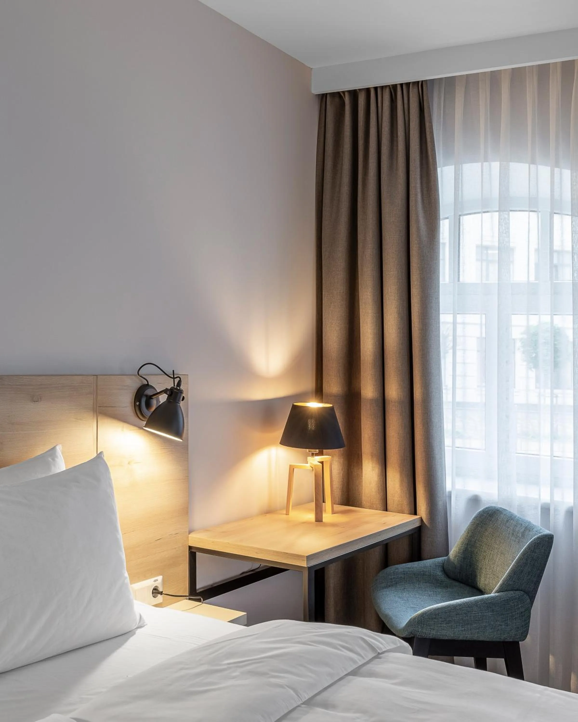 Bed in KONTRAKT Boutique Hotel