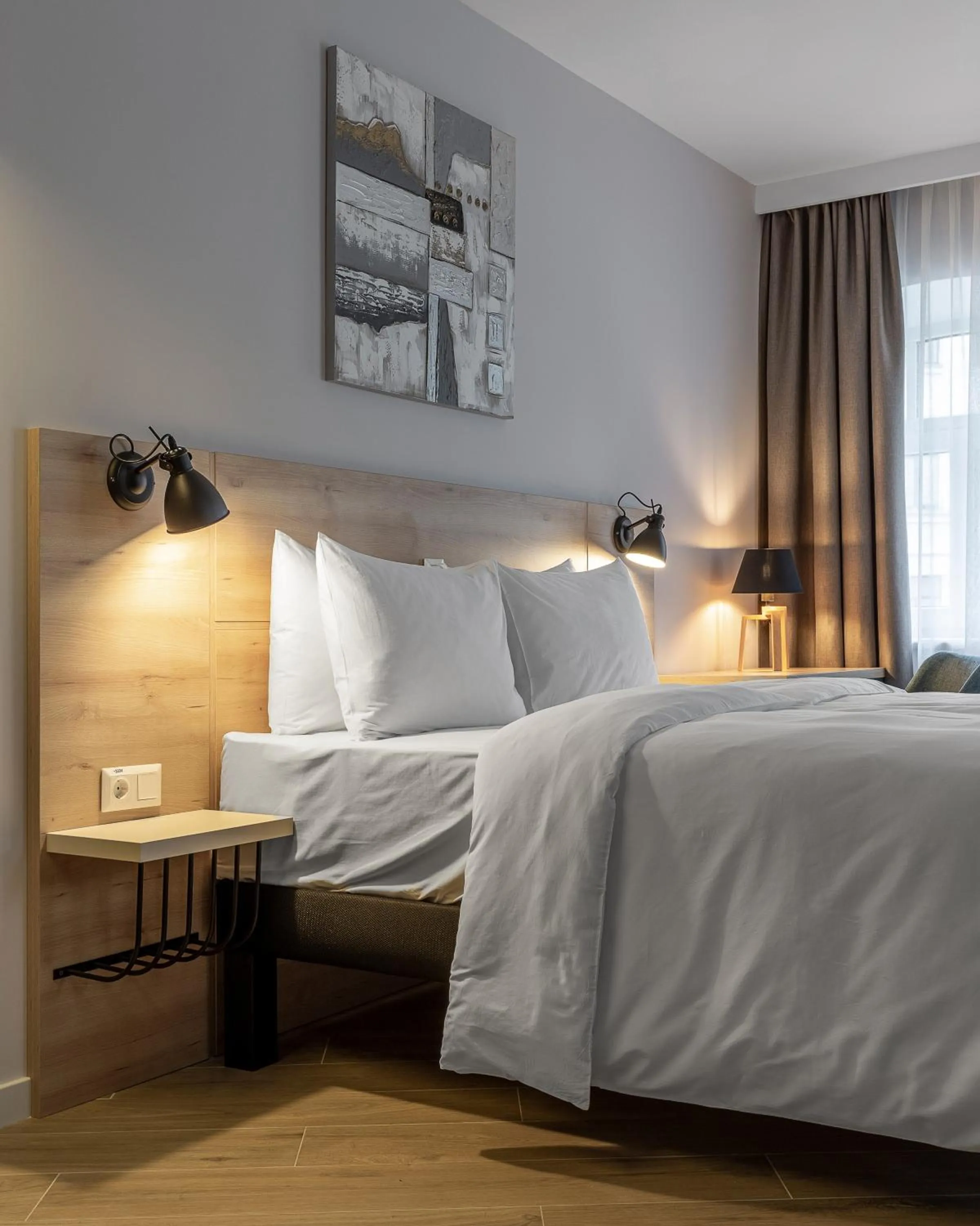 Bed in KONTRAKT Boutique Hotel