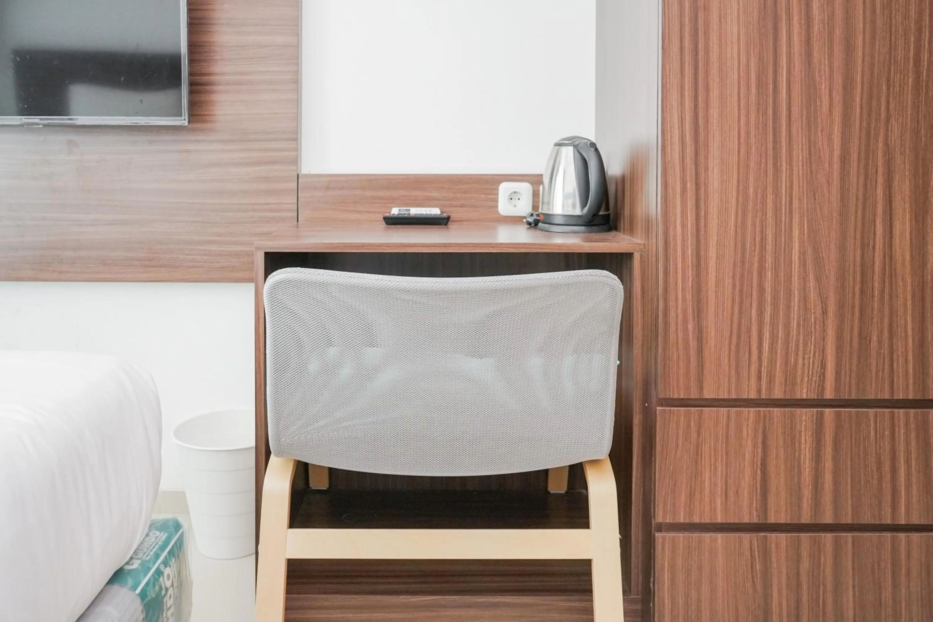 Bedroom in Modern Studio Apartment at Tree Park Cikokol By Travelio