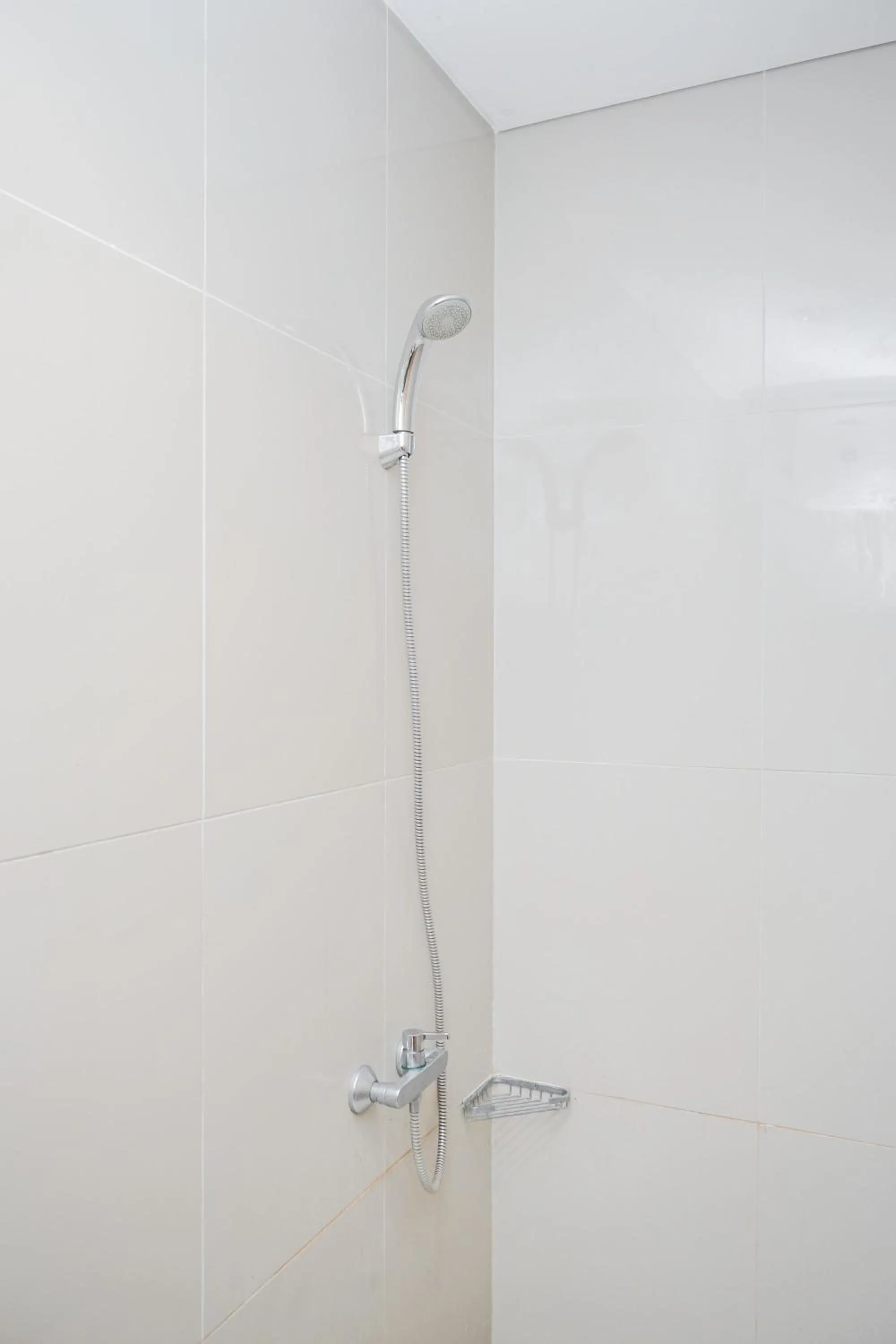 Bathroom in Modern Studio Apartment at Tree Park Cikokol By Travelio