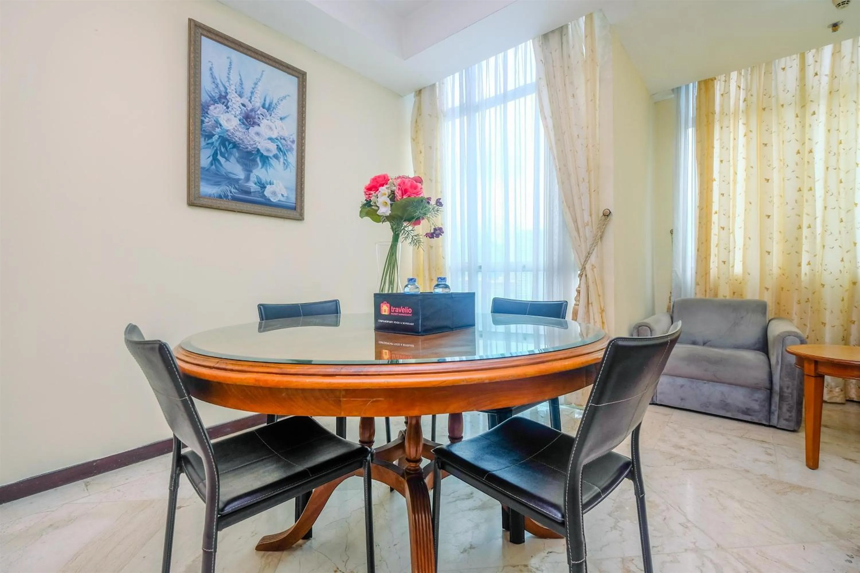 Dining area in Exclusive with City View 3BR Apartment Bellagio Residence By Travelio