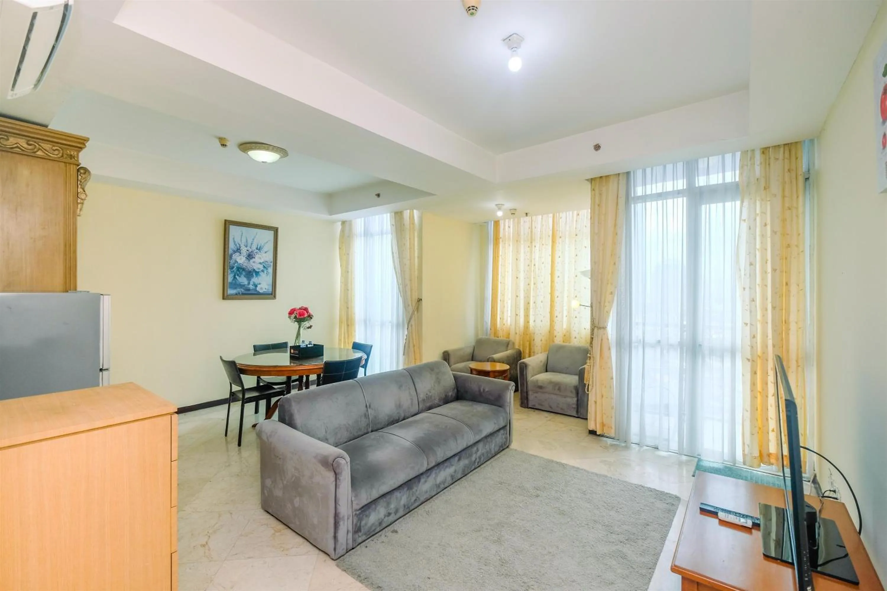 Living room in Exclusive with City View 3BR Apartment Bellagio Residence By Travelio