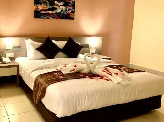 Bed in KLUANG RIVERVIEW HOTEL