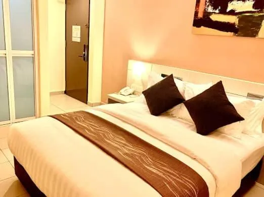Bed in KLUANG RIVERVIEW HOTEL