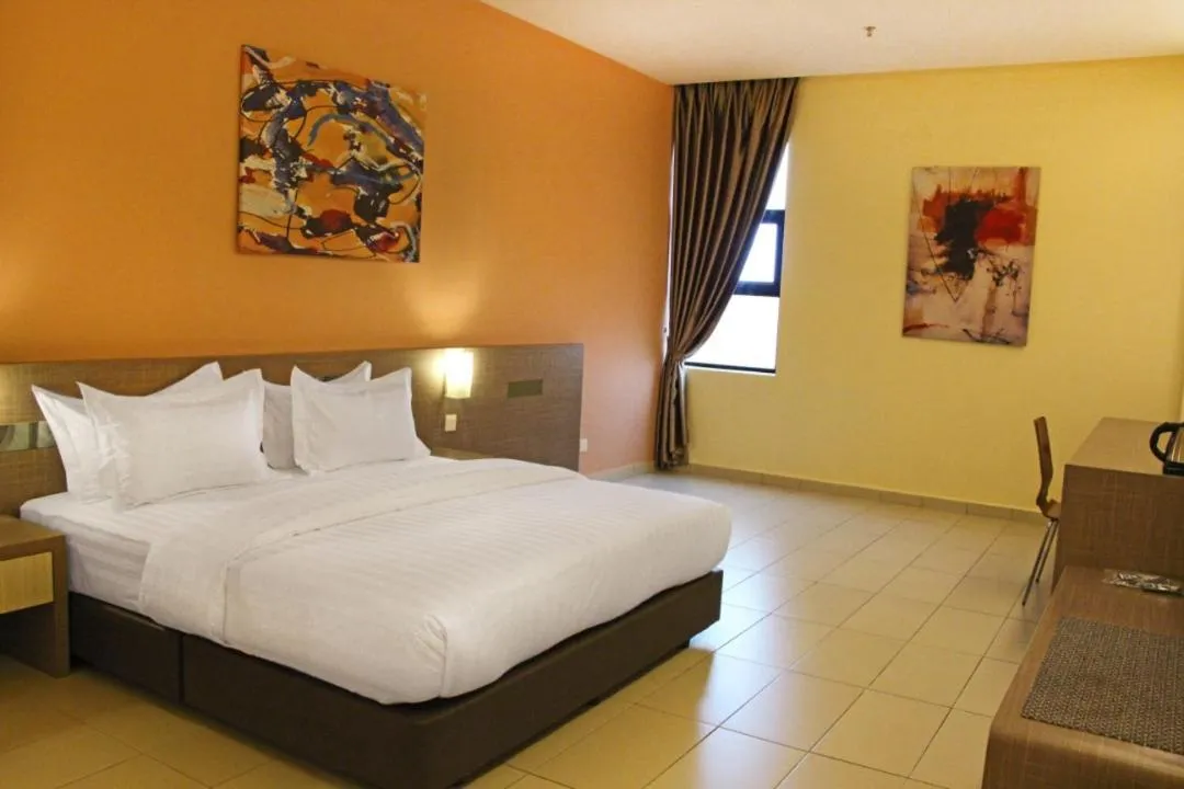 Bed in KLUANG RIVERVIEW HOTEL