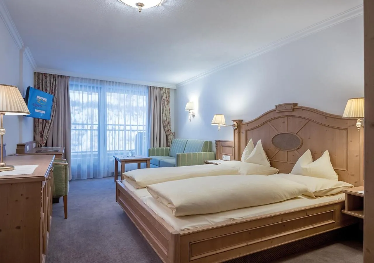 Seating area, Bed in Hotel Alpenland