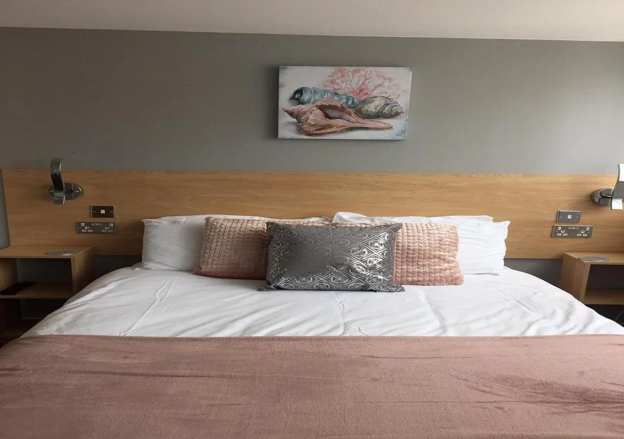 Bed in The Beaucliffe Hotel