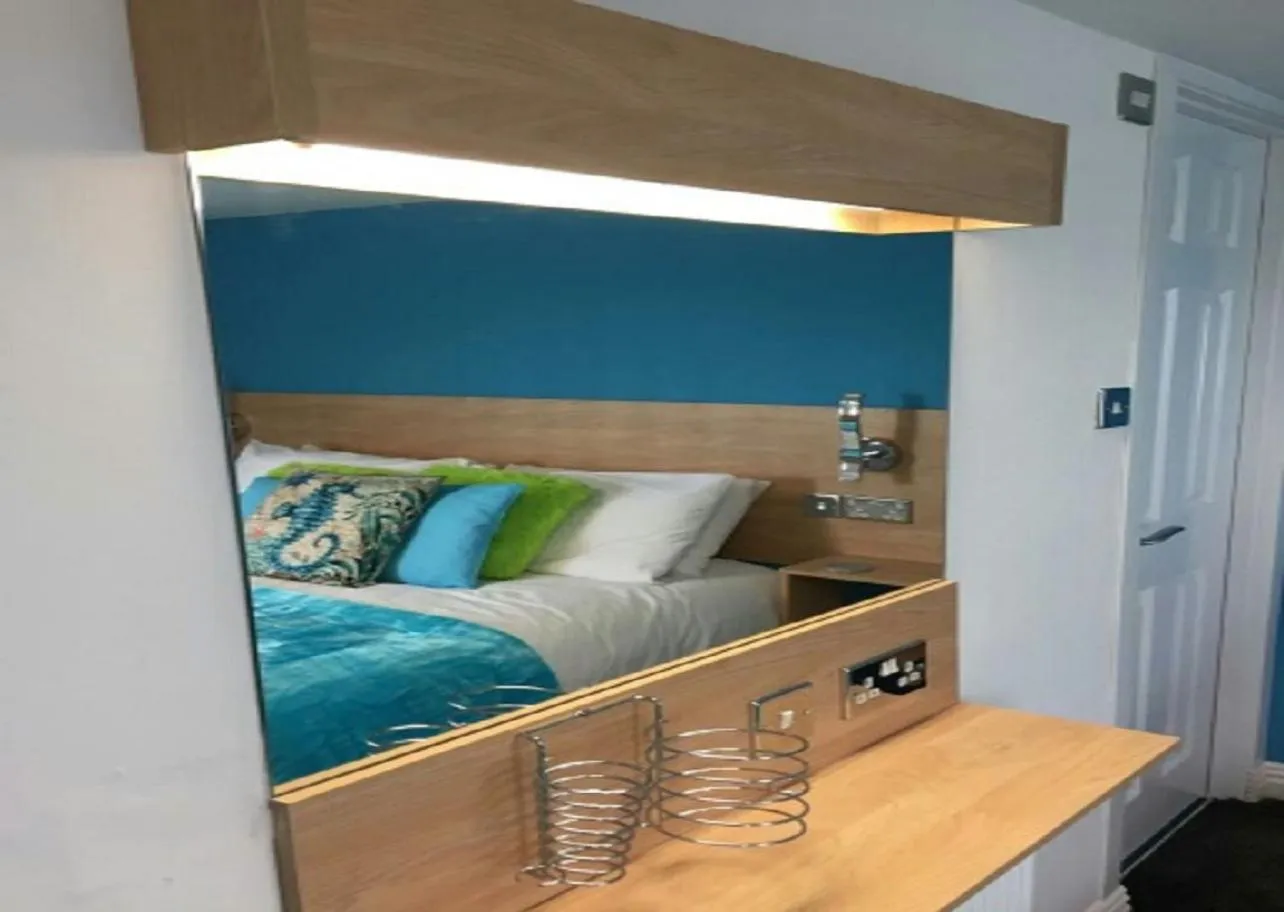 Bed in The Beaucliffe Hotel