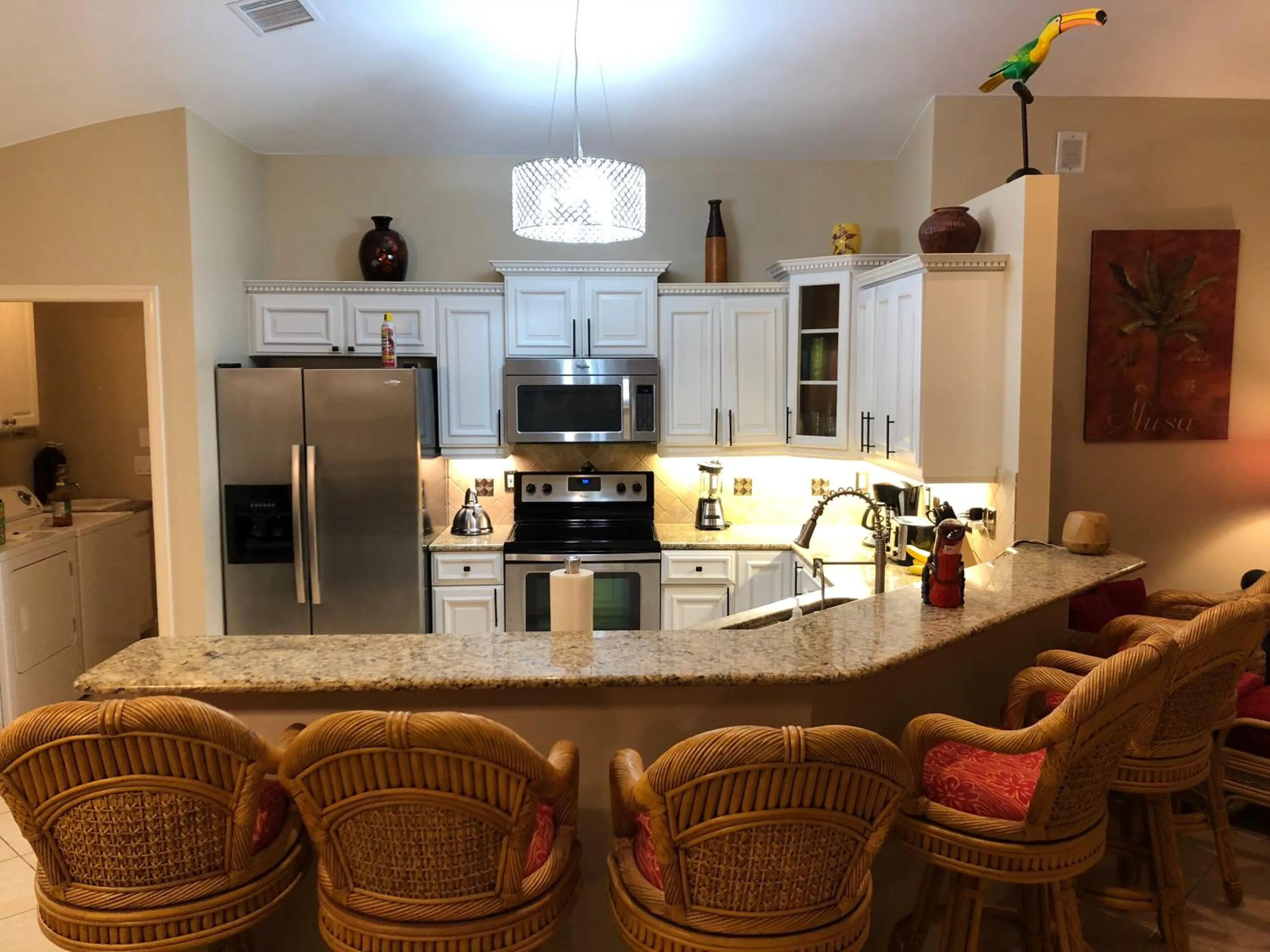 Kitchen or kitchenette in Tiki Paradise House & pool - 10 min to Beach!