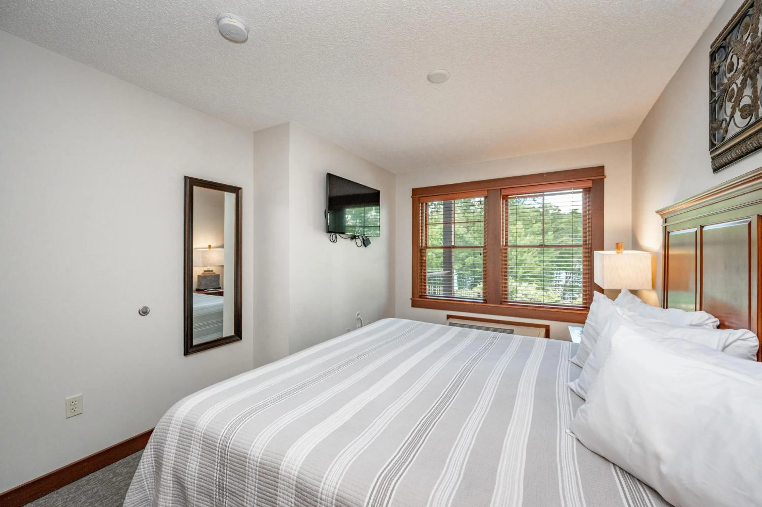 Bed in A117 One Bedroom Lake View