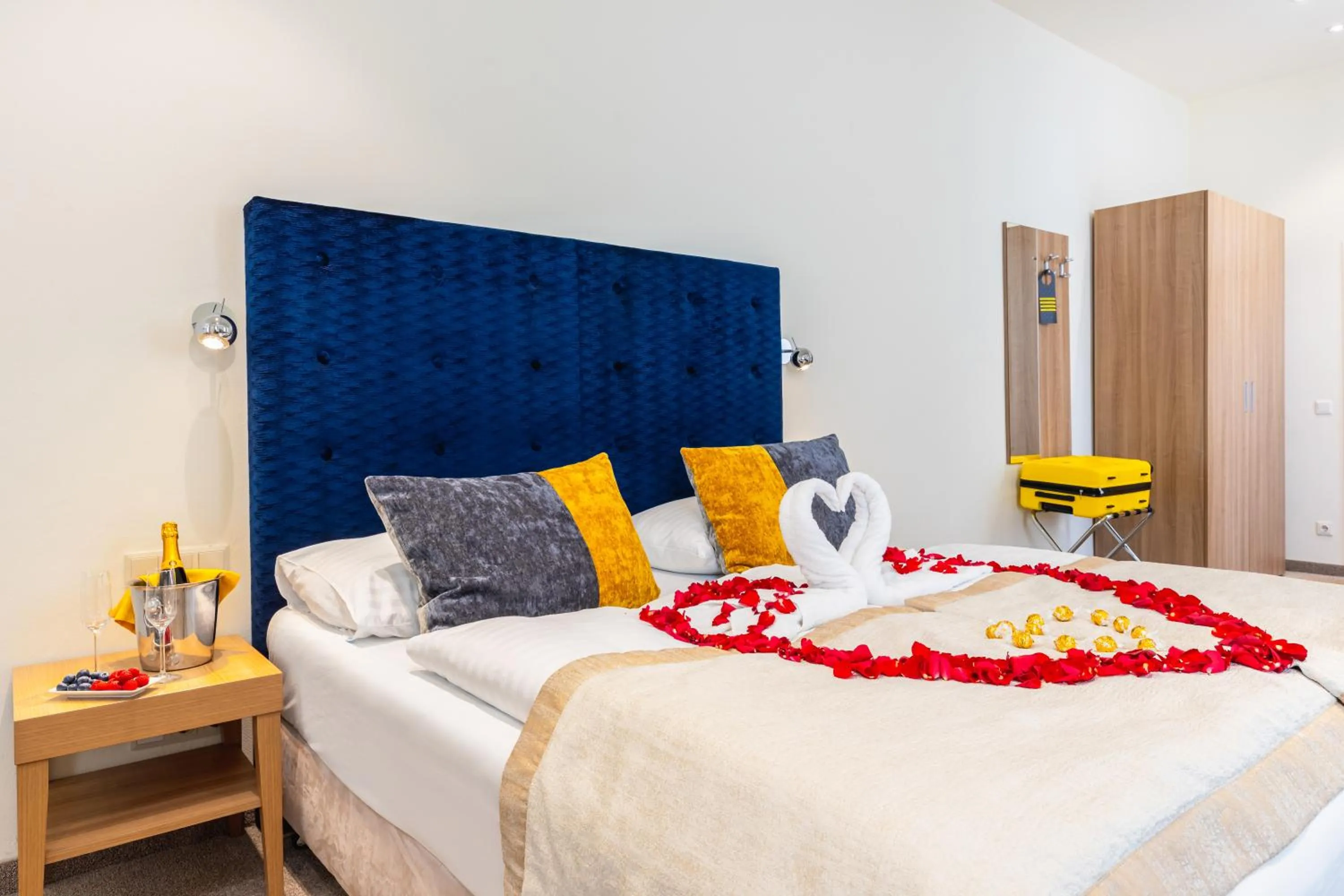 Bed in HiLight Suites Hotel