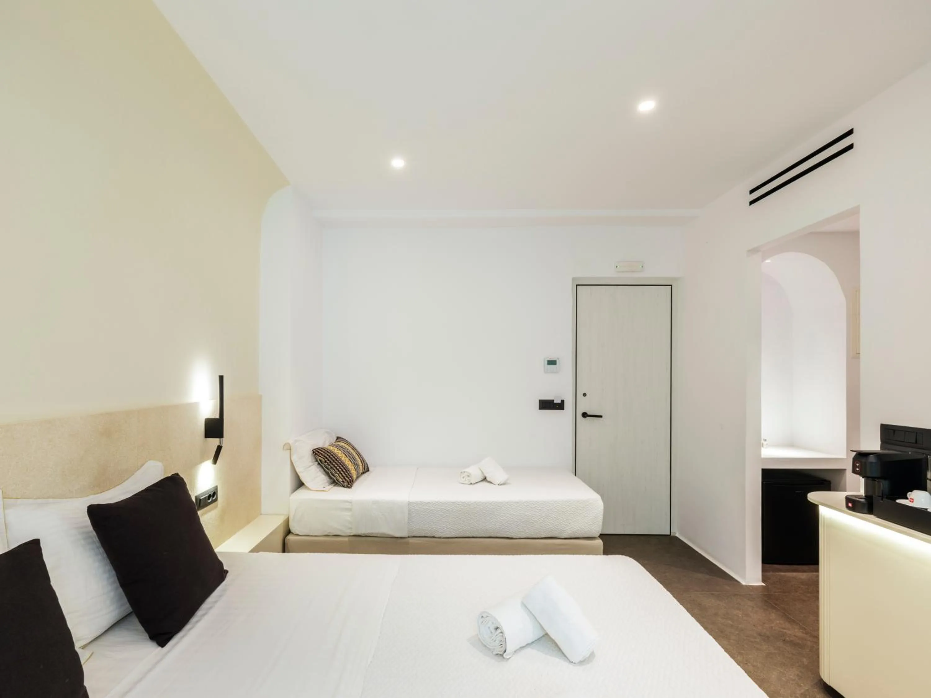 Bed in Yalos Hotel Sunset view Mykonos town private rooms